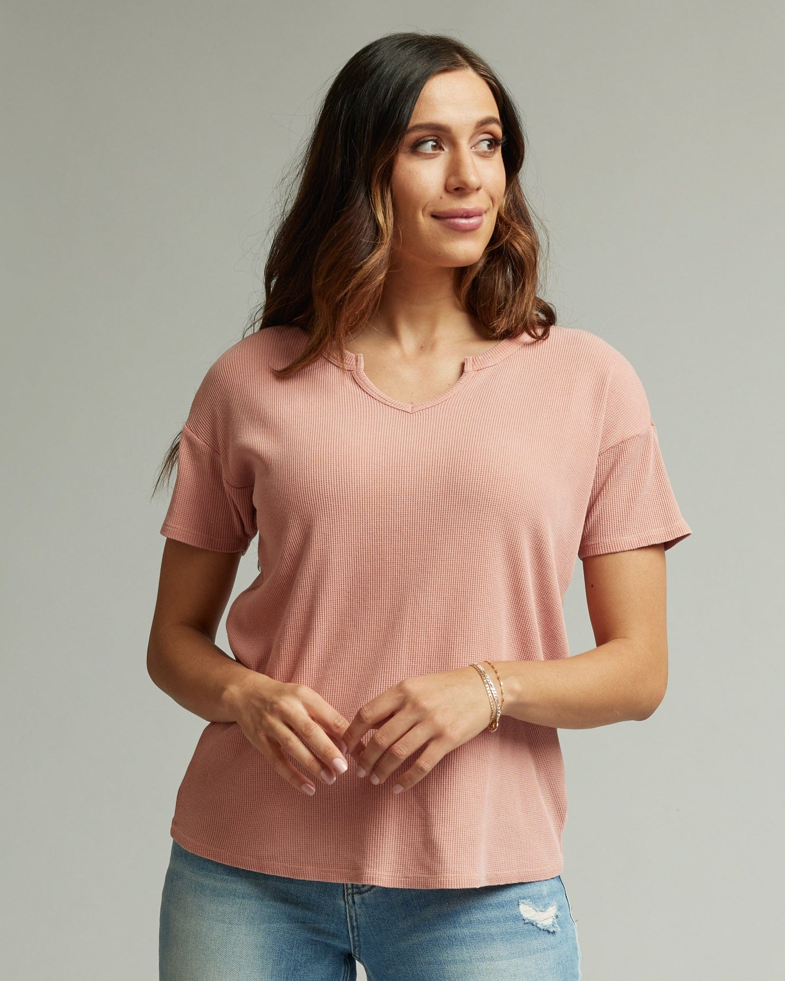Woman in a pink, short sleeve top