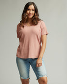 Woman in a pink, short sleeve top