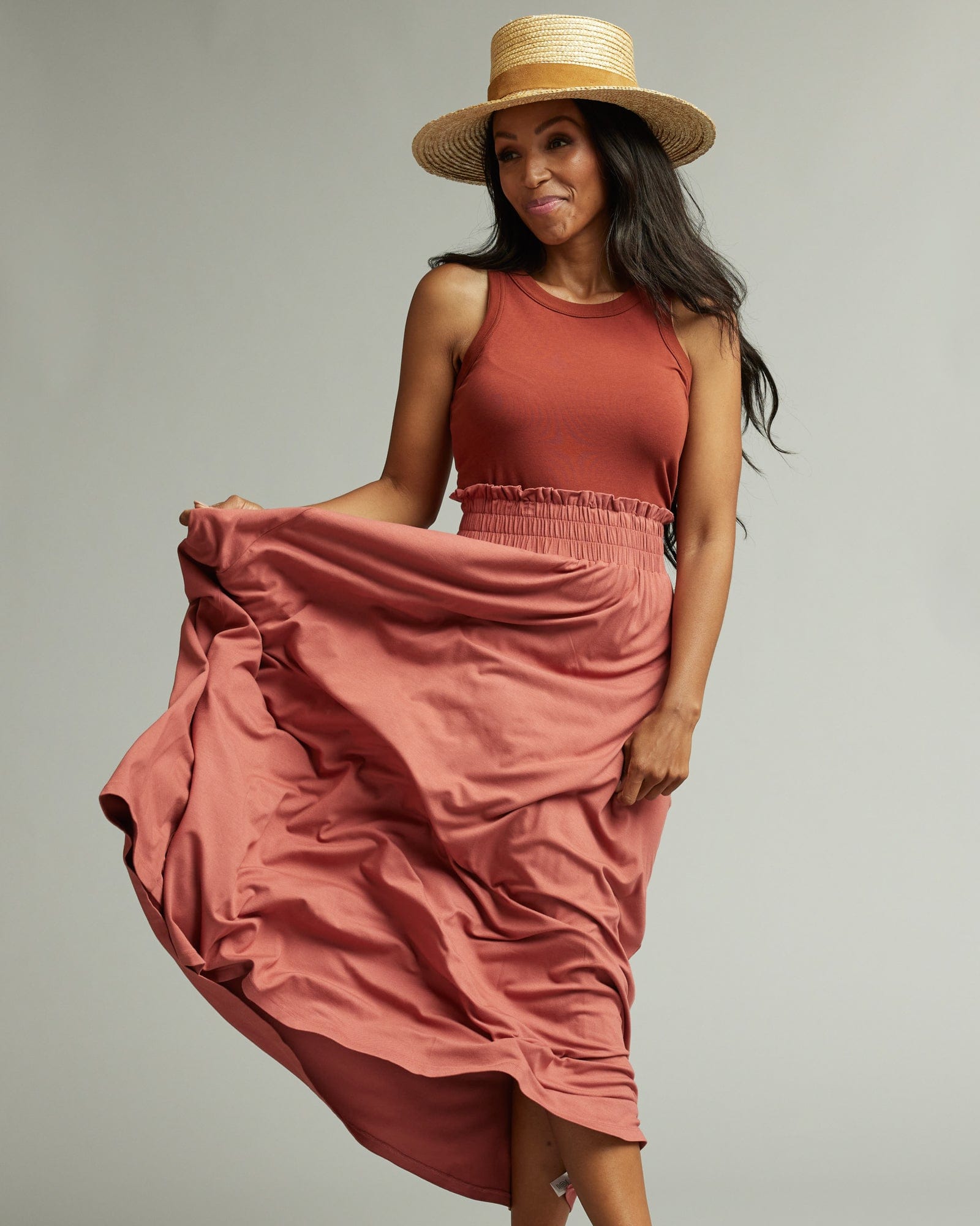 Woman in a pink maxi skirt