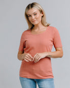 Woman in a half sleeved, ribbed t-shirt