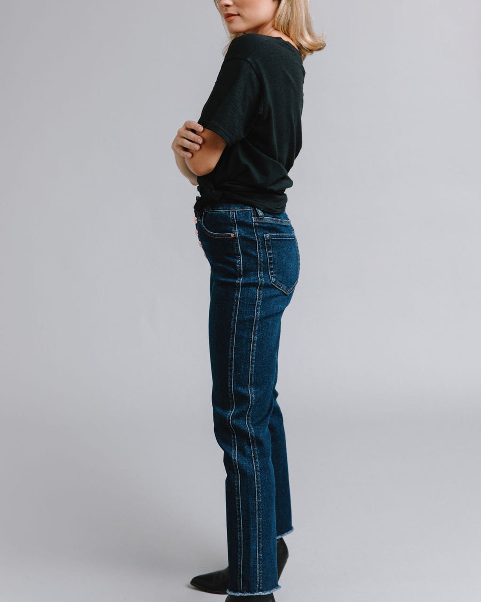 Woman in mid-rise blue jeans