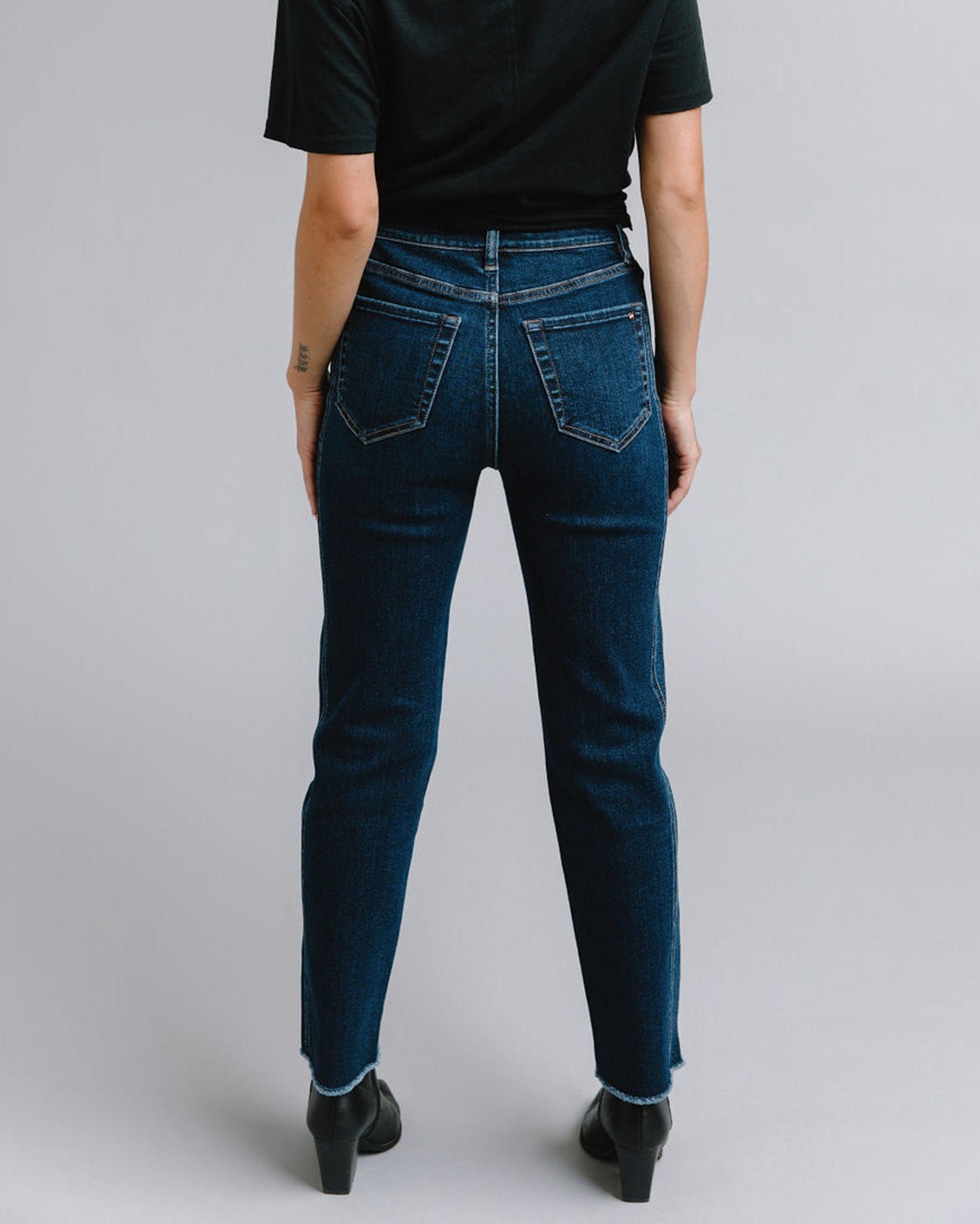 Woman in mid-rise blue jeans