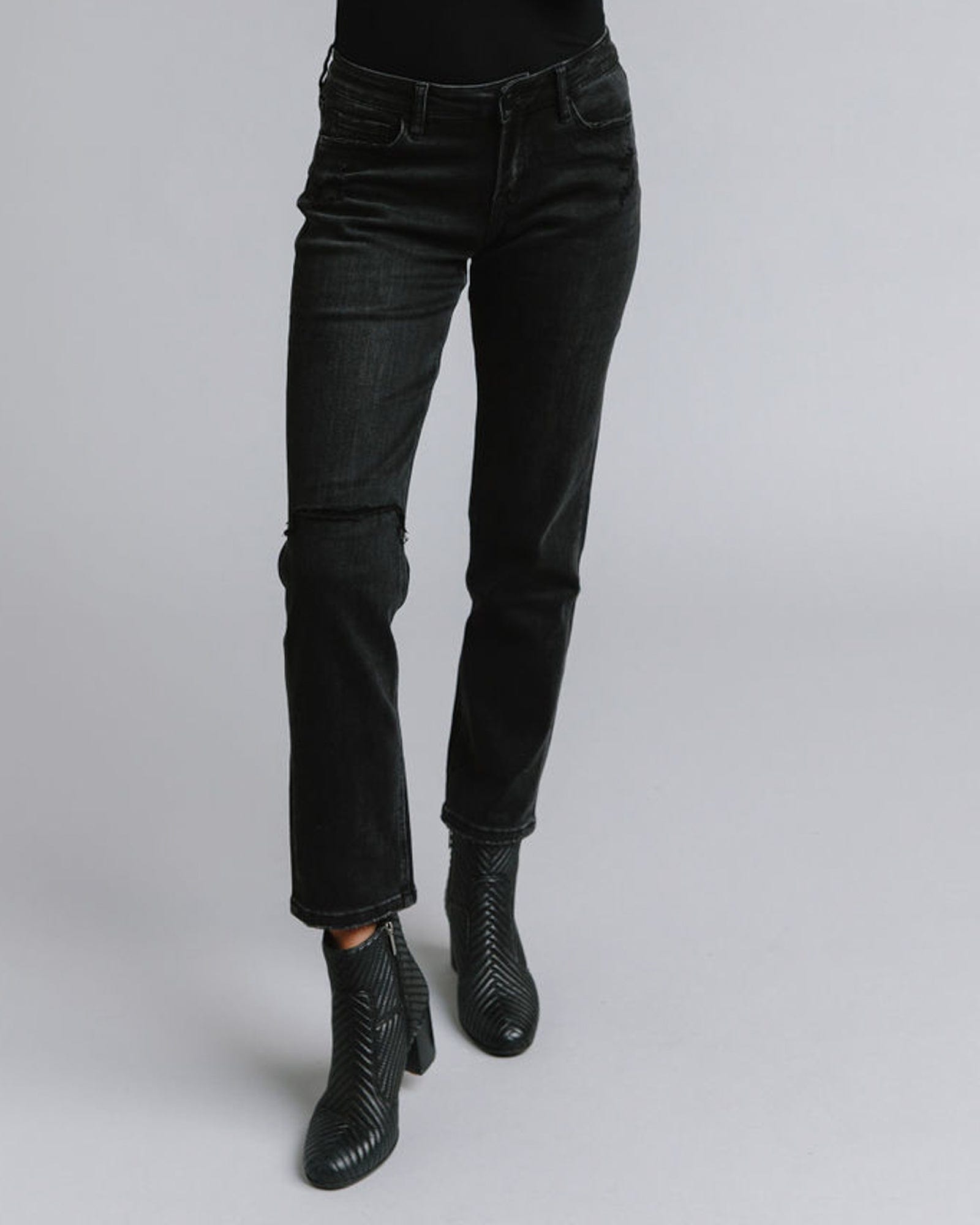 Woman in black mid-rise boyfriend jeans