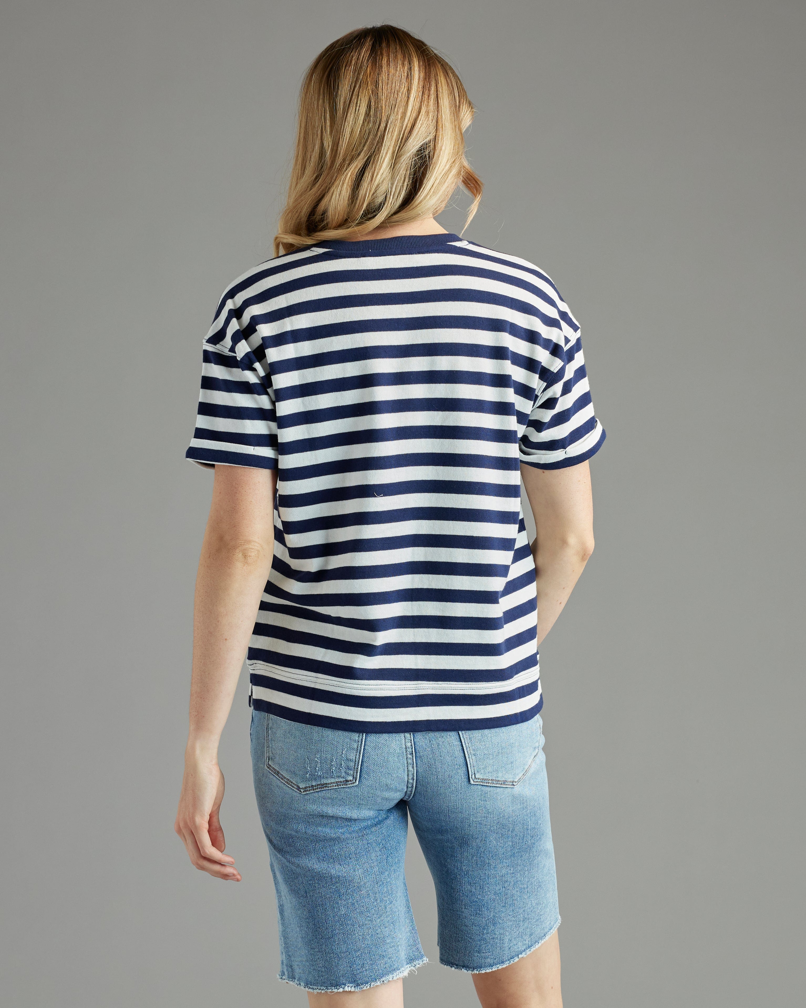 Woman in a blue and white striped short sleeve t-shirt