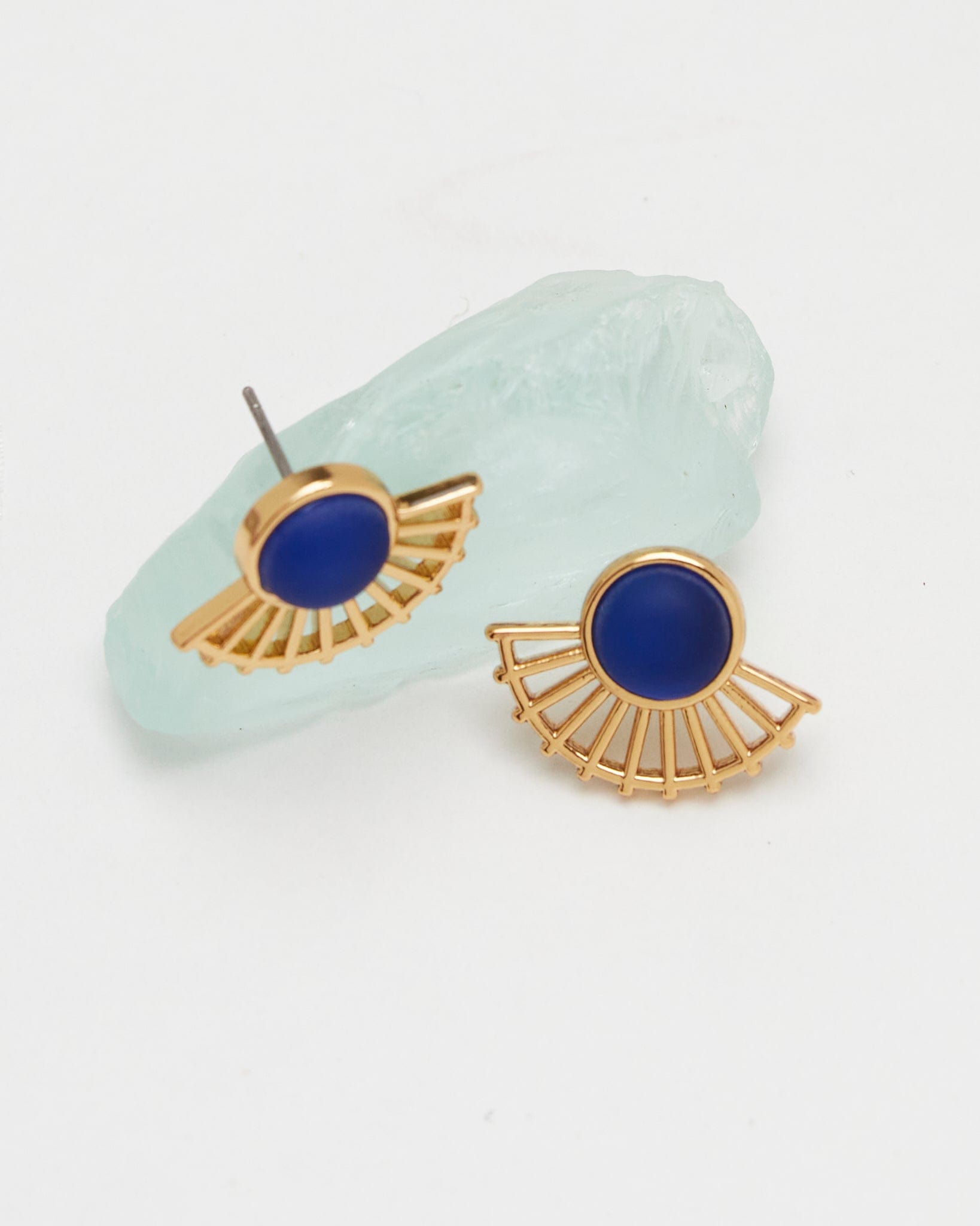 Gold fan earrings with blue gem in middle