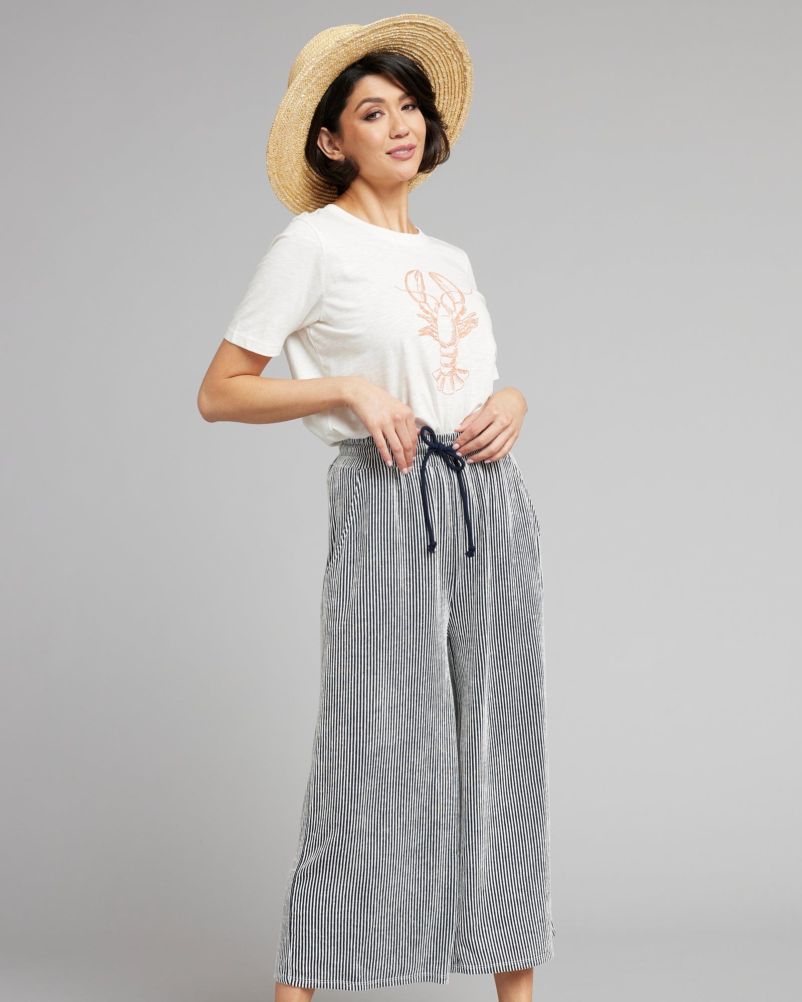 Woman in gray and white capris