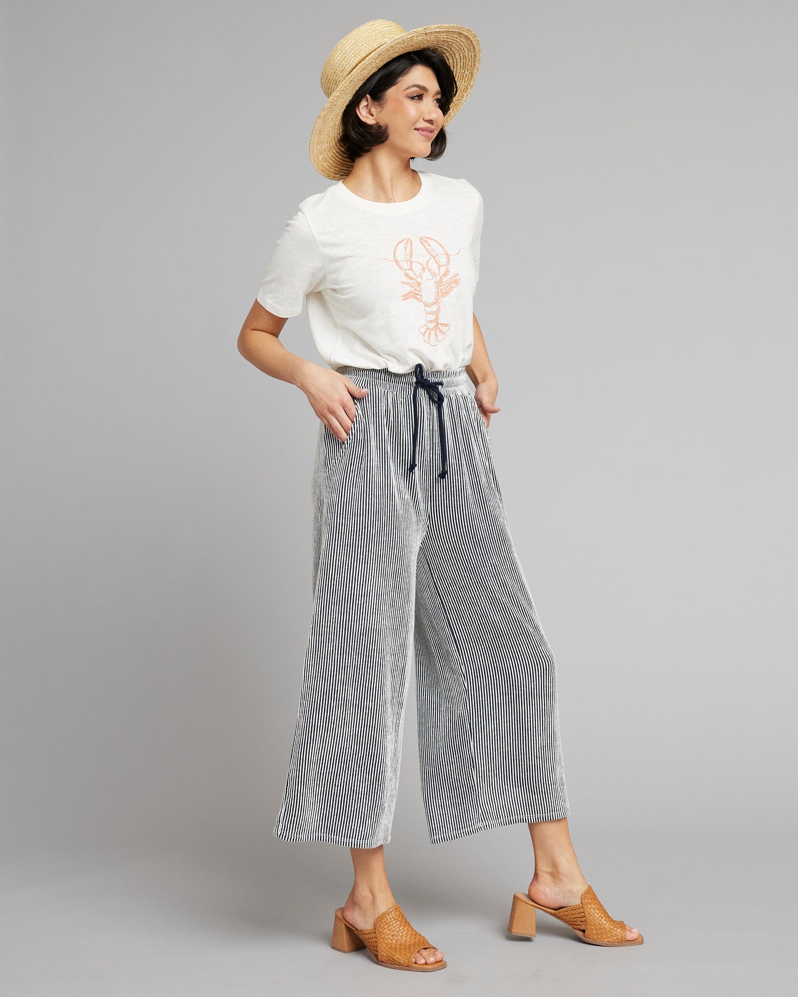 Woman in gray and white capris