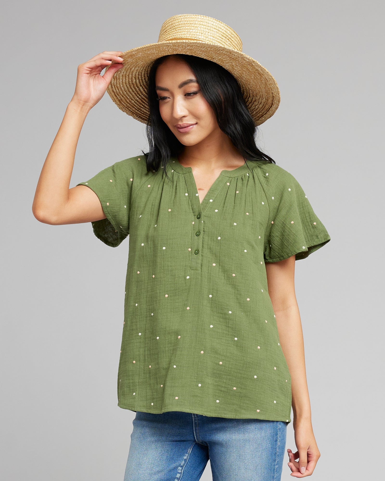 Woman in a short sleeve, v-neck with buttons top