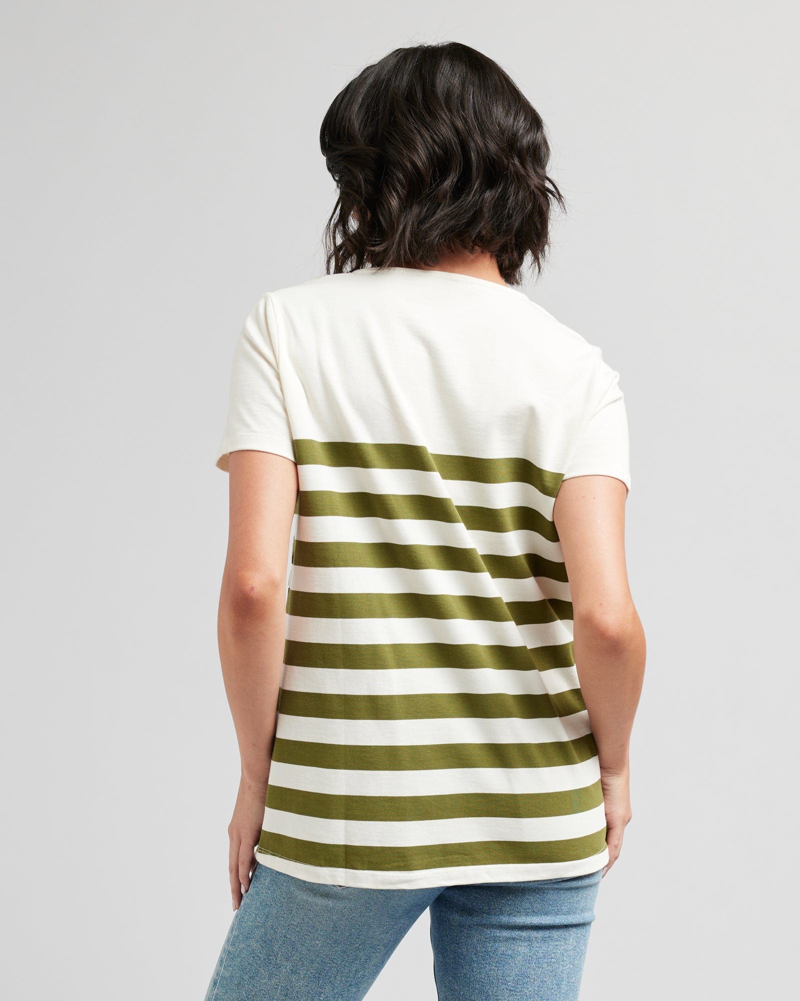 Woman in a short sleeve, green and white striped top
