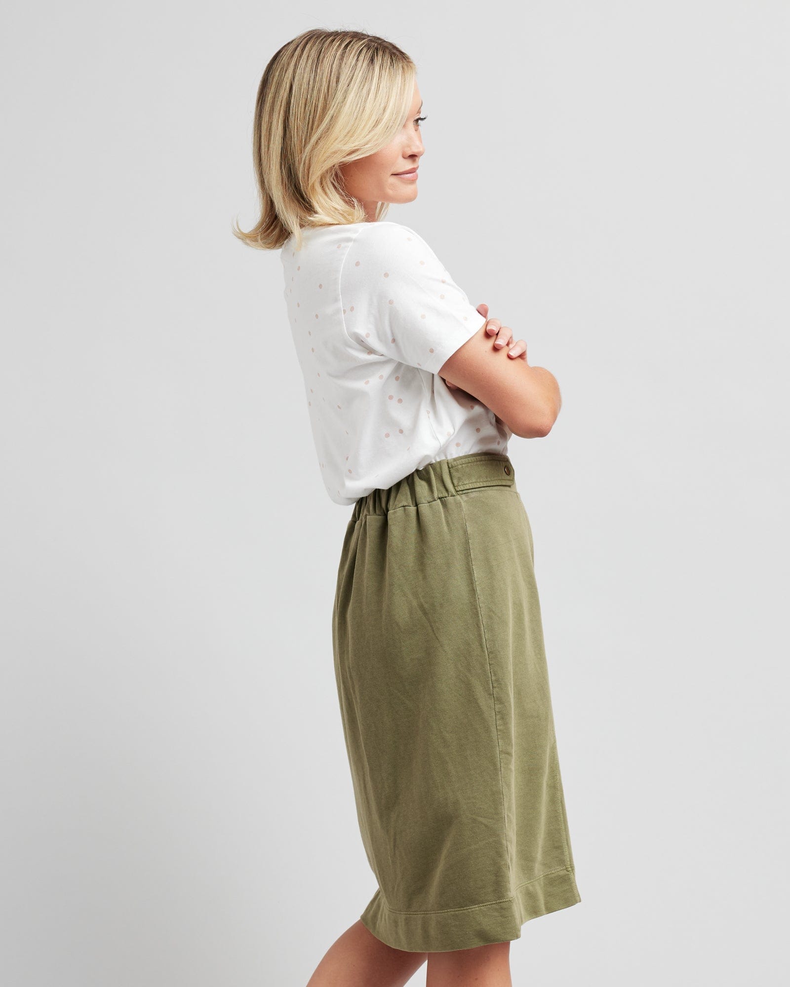 Woman in a green knee-length skirt