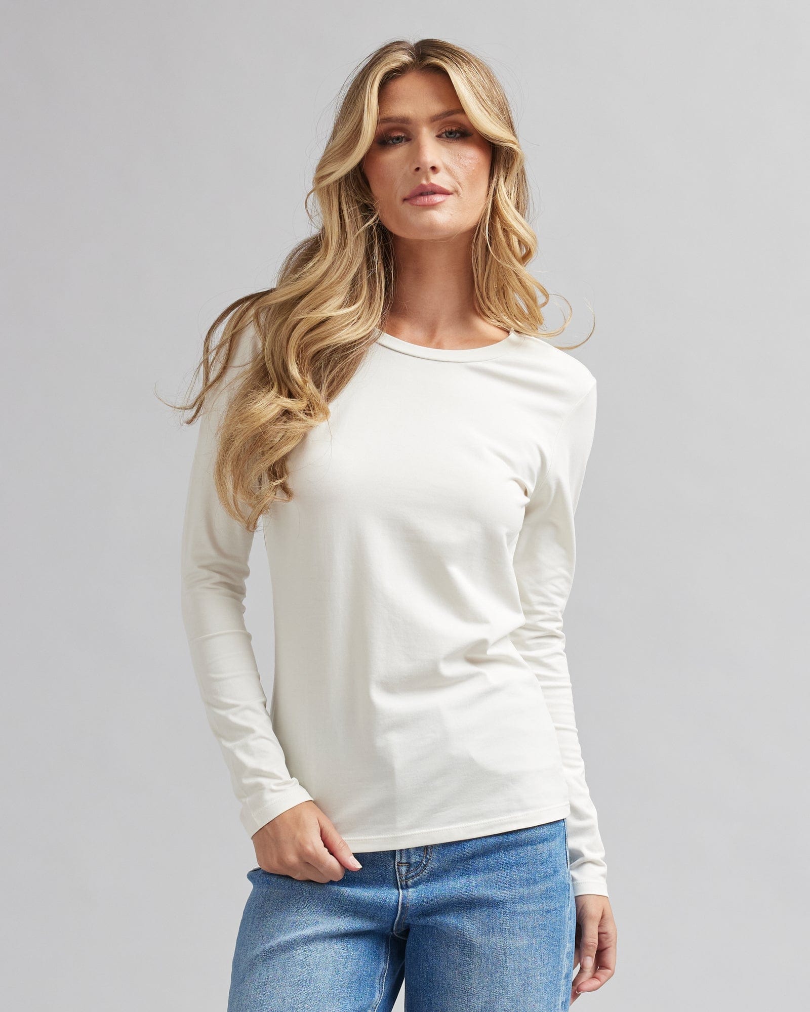 Woman in a long sleeve, semi-fitted, basic t-shirt