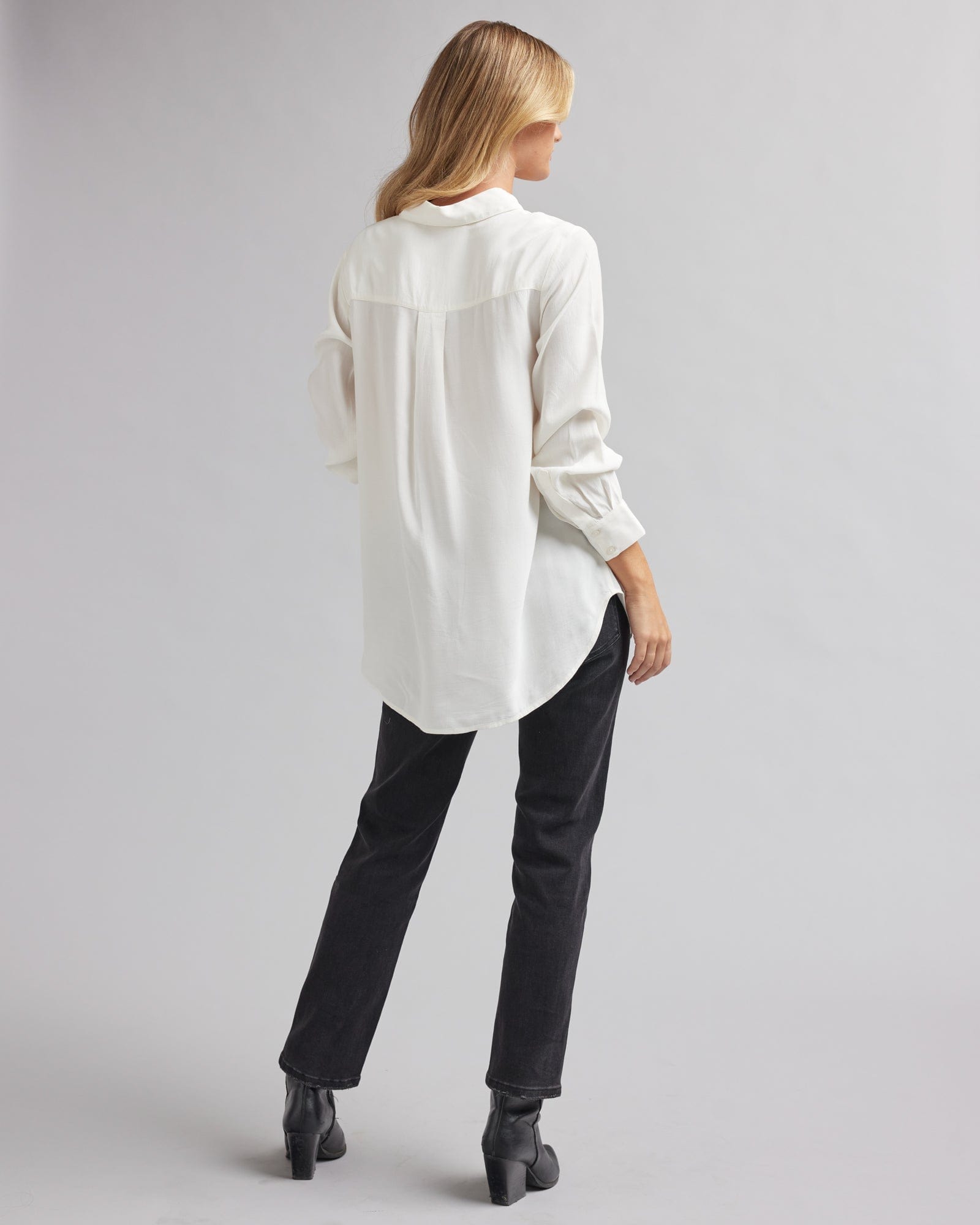 Woman in a long sleeve, white, double check pocket button-up