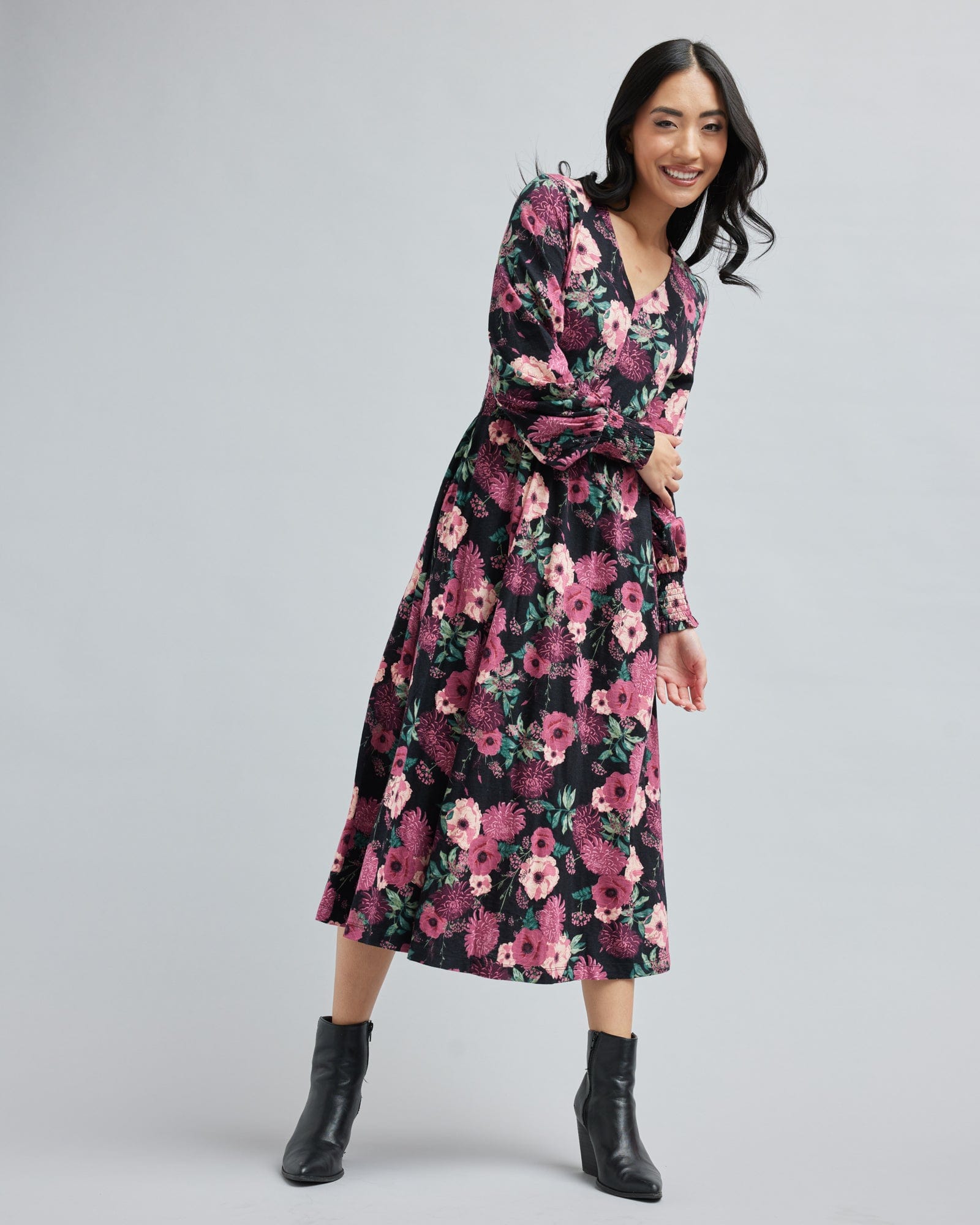 Woman in a long sleeve, floral print, midi-dress