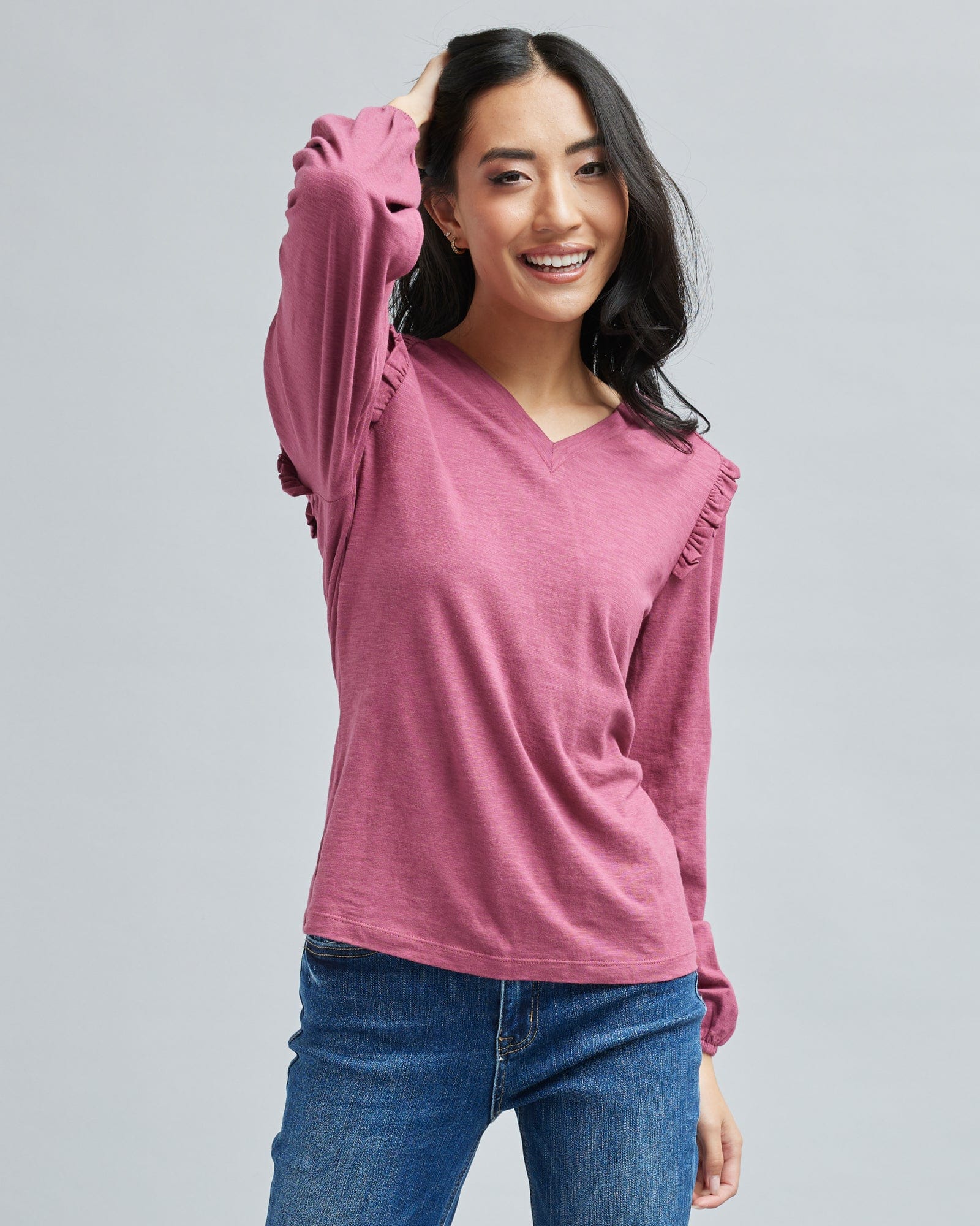 Woman in a long sleeve, pink t-shirt
