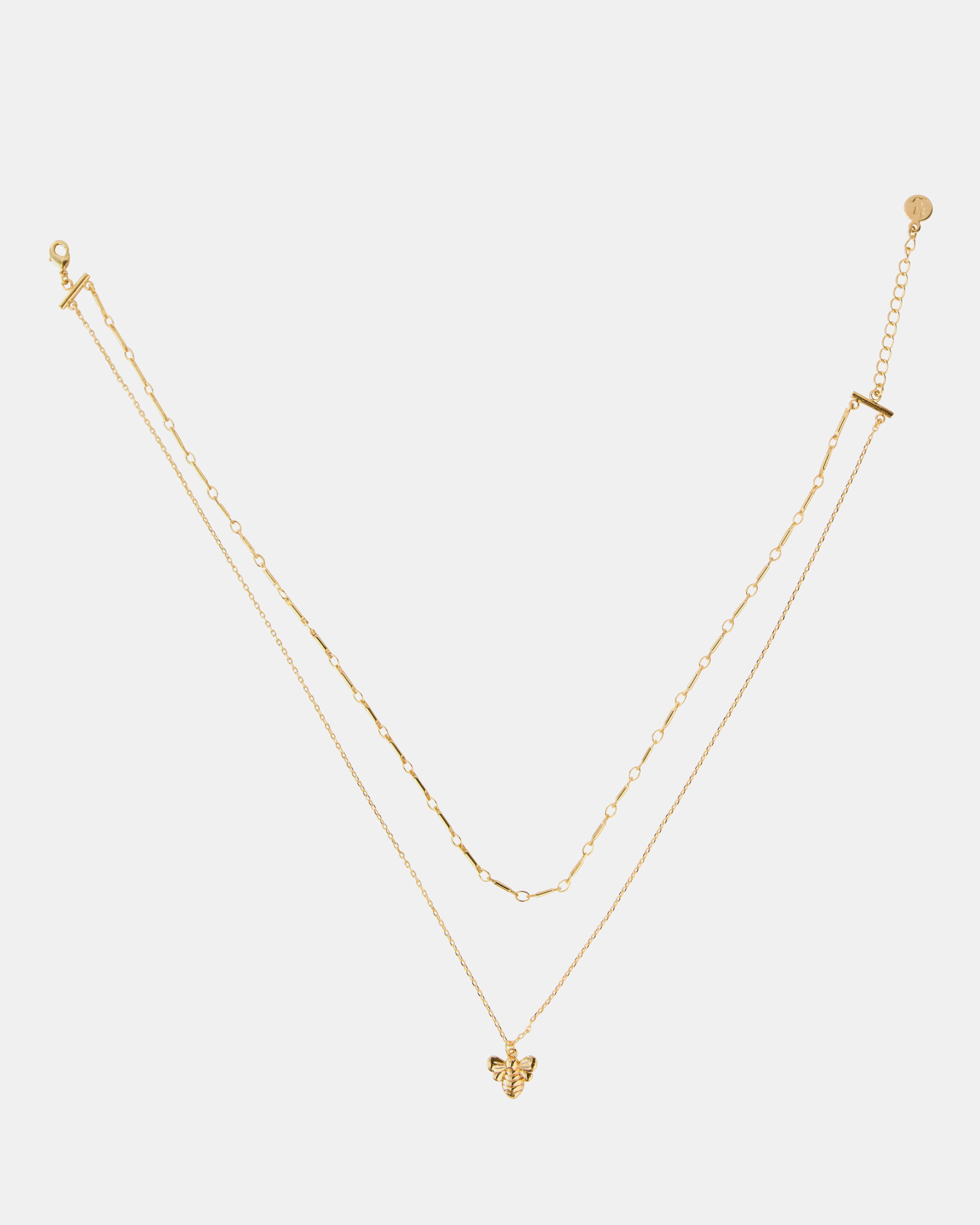 Gold two-chain necklace with bee charm.