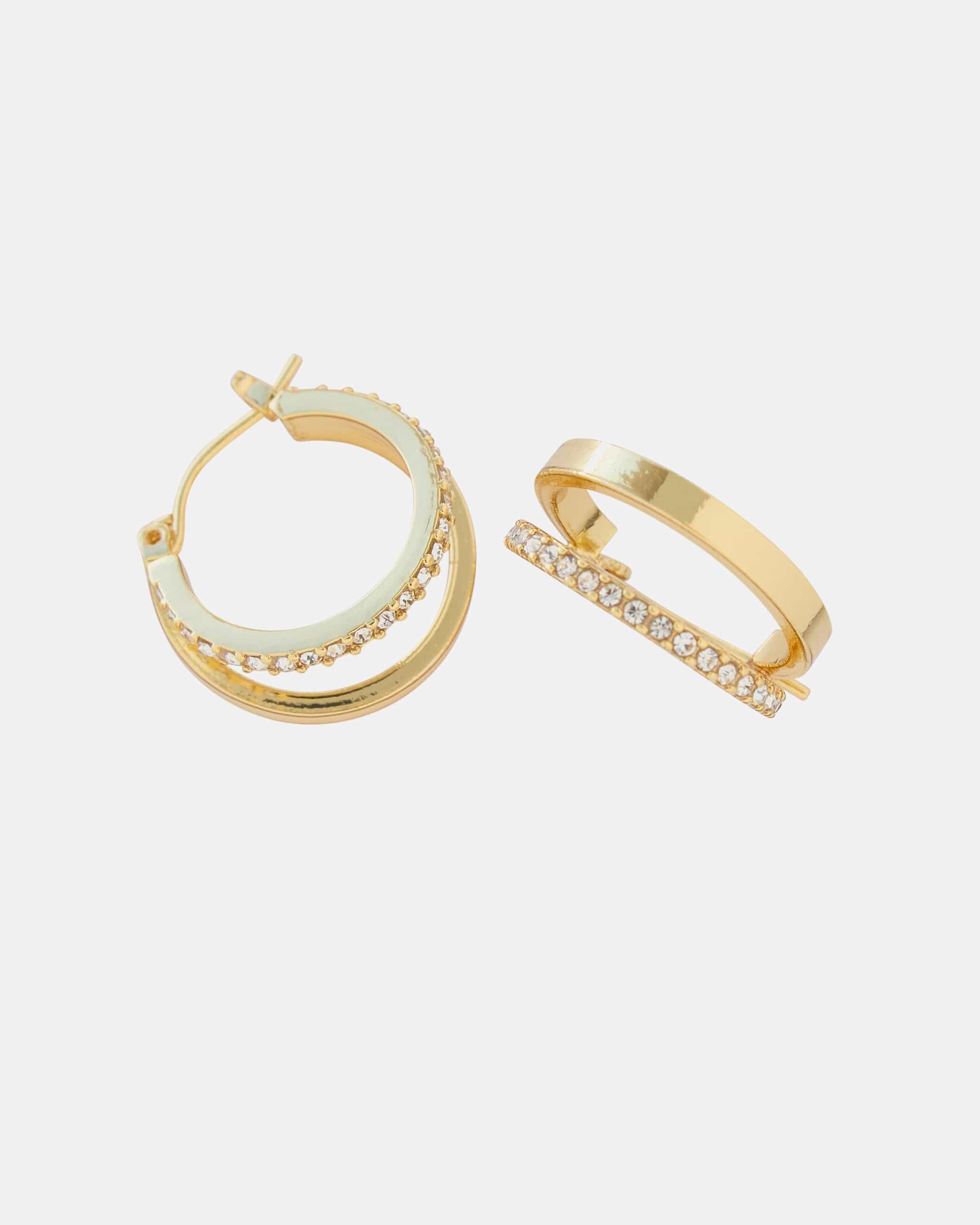Gold huggie hoop earrings with glass stones.