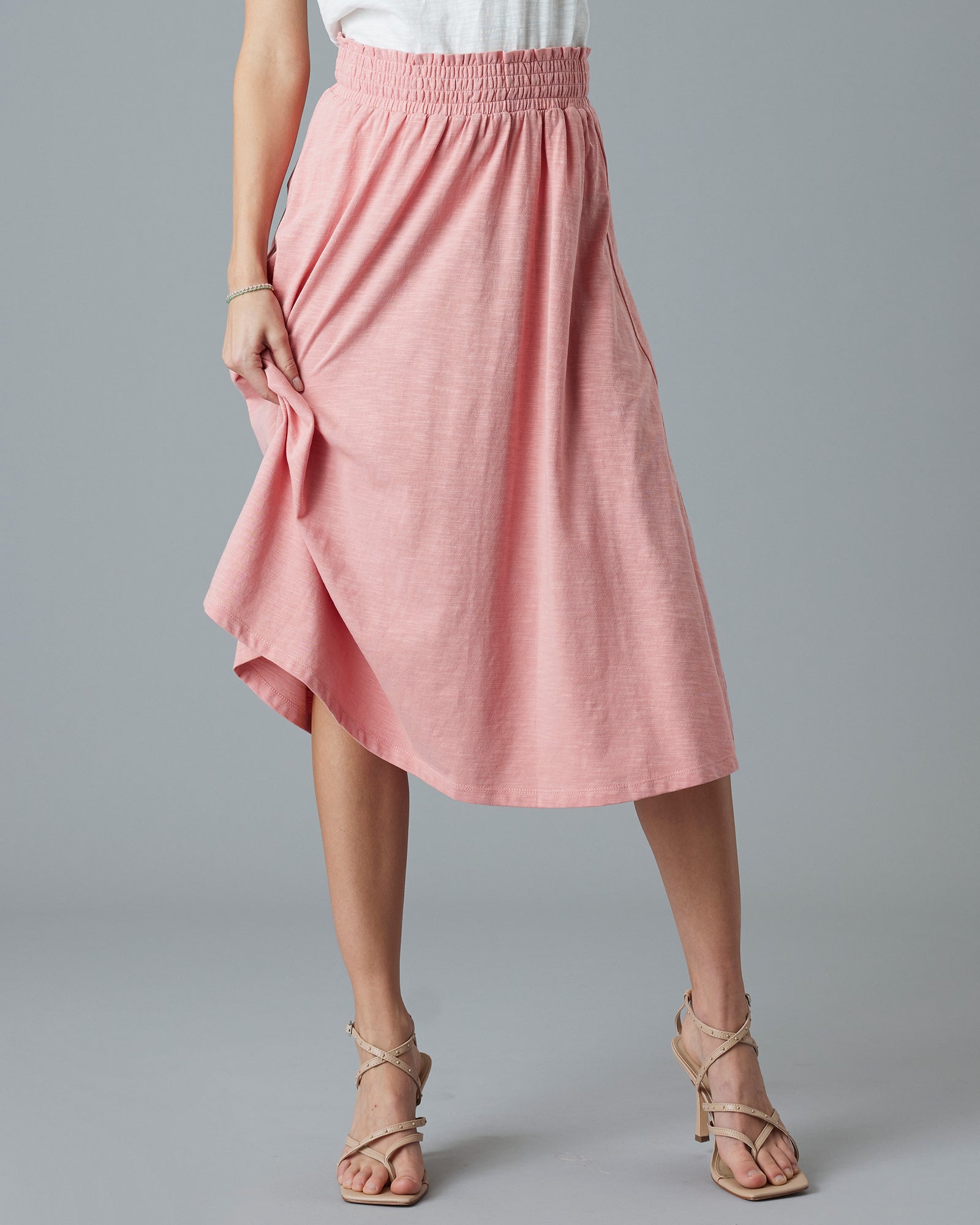 Woman in a pink midi-length dress