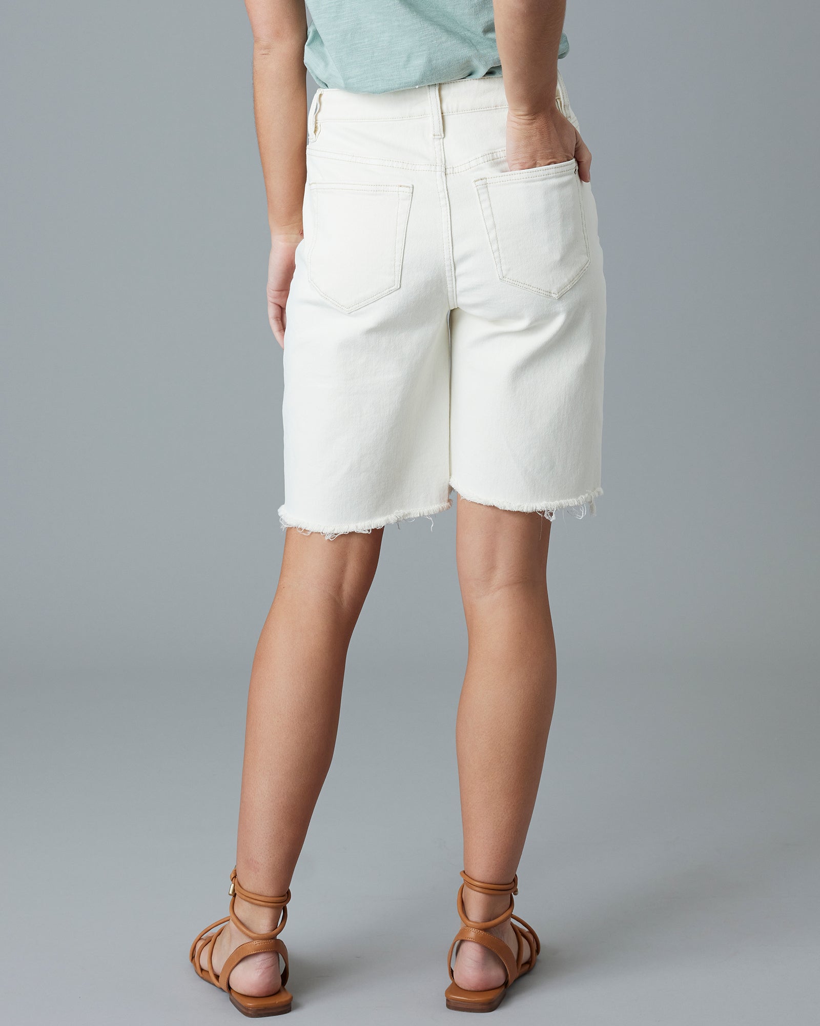 Woman in white jean, relaxed shorts
