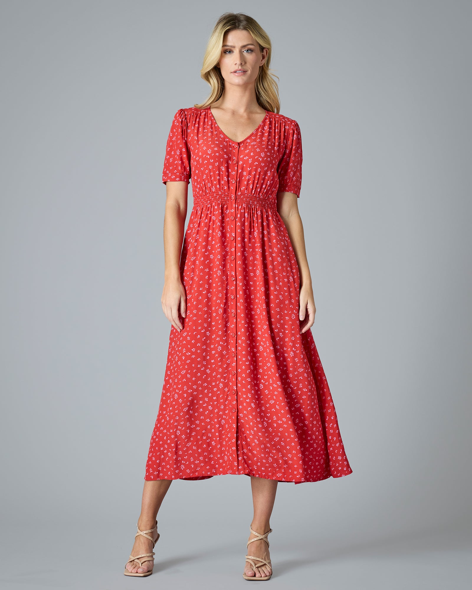 Woman in a red short sleeve midi-length dress