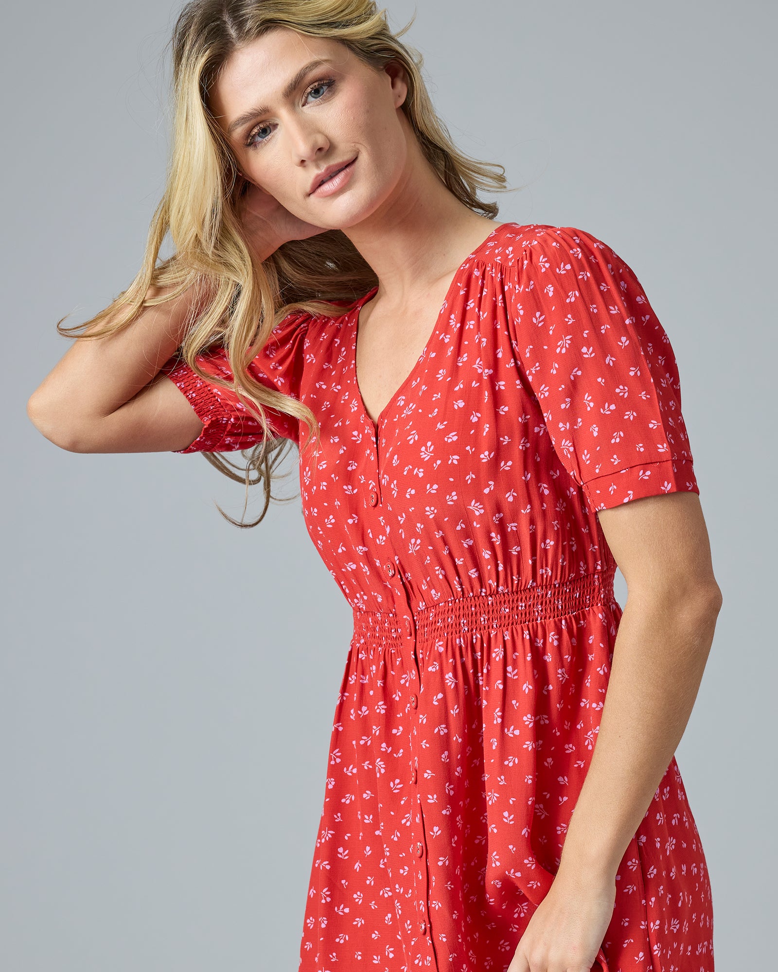 Woman in a red short sleeve midi-length dress