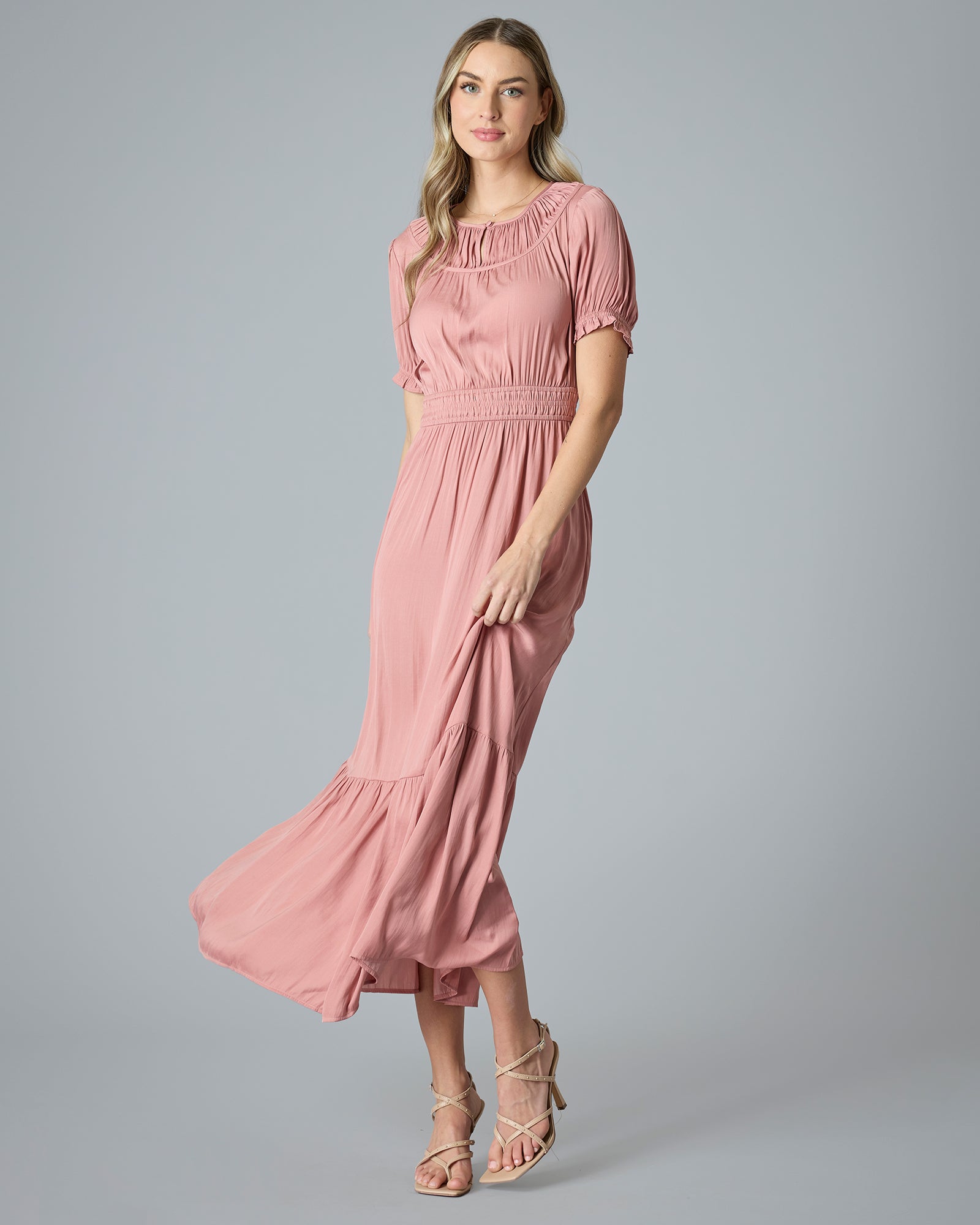 Woman in a pink short sleeve maxi dress