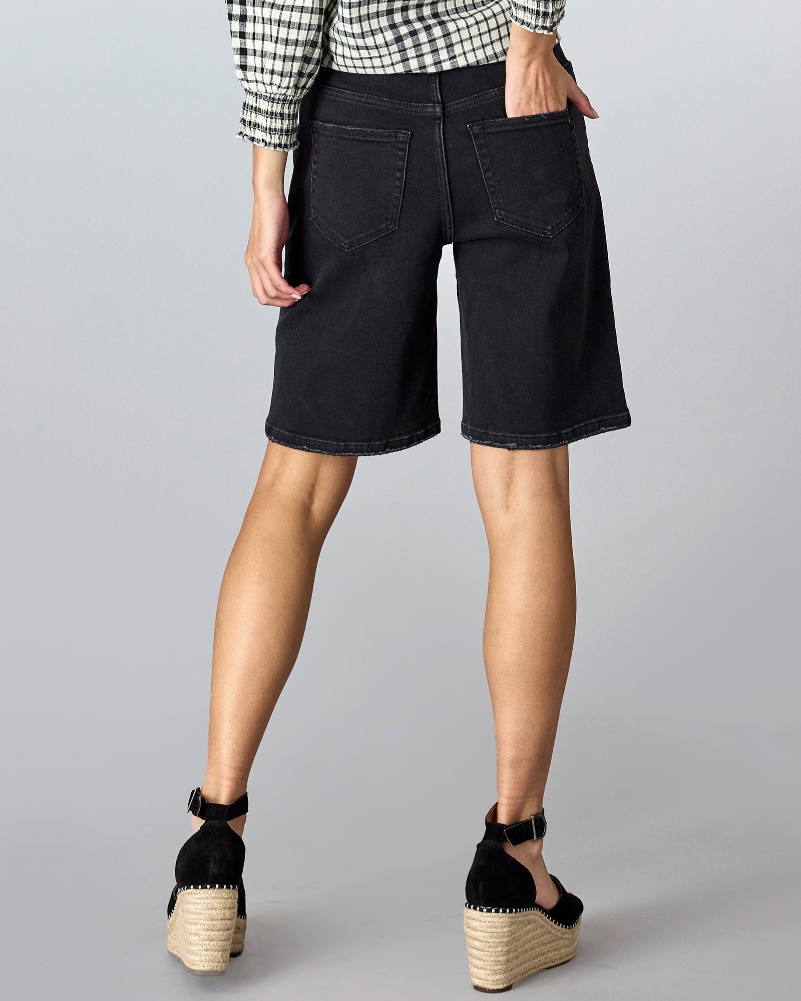 Woman in baggy bermuda shorts.