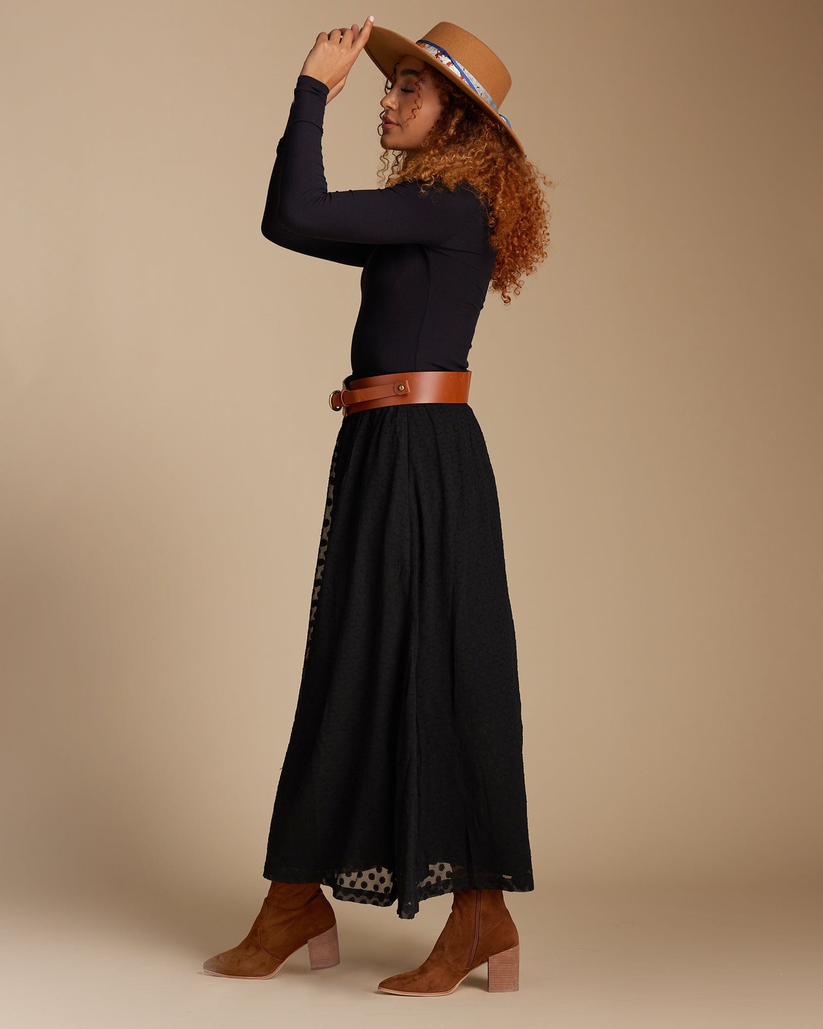 Woman in a black maxi-length skirt