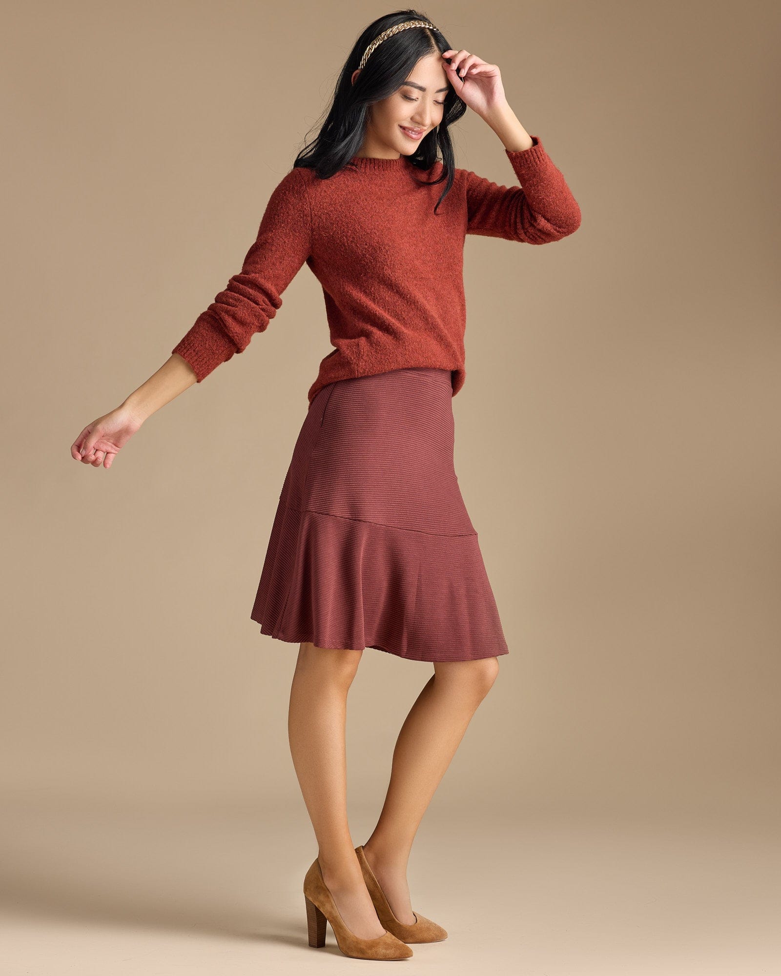 Woman in a knee-length flounce skirt