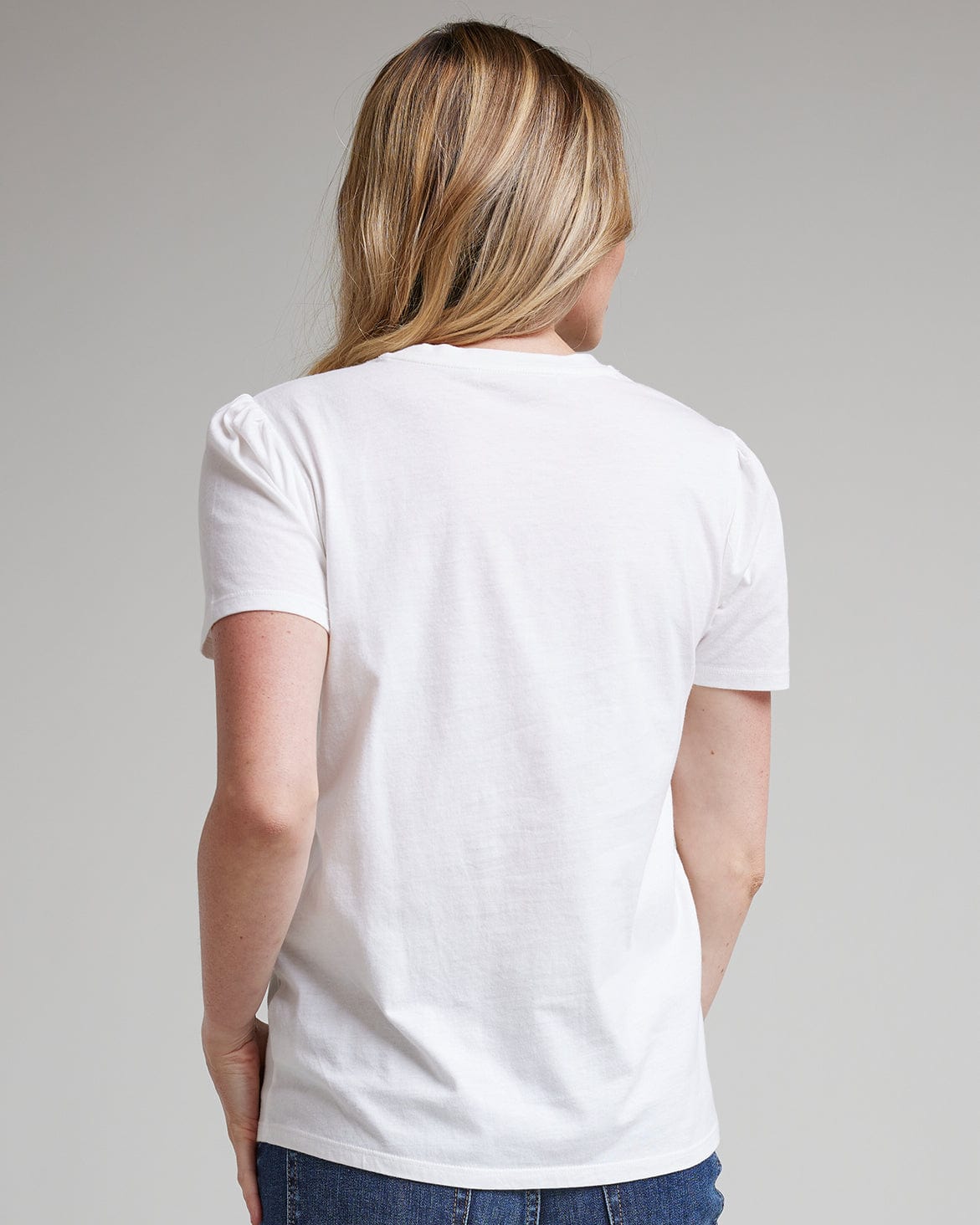 Woman in a white, short sleeve basic t-shirt
