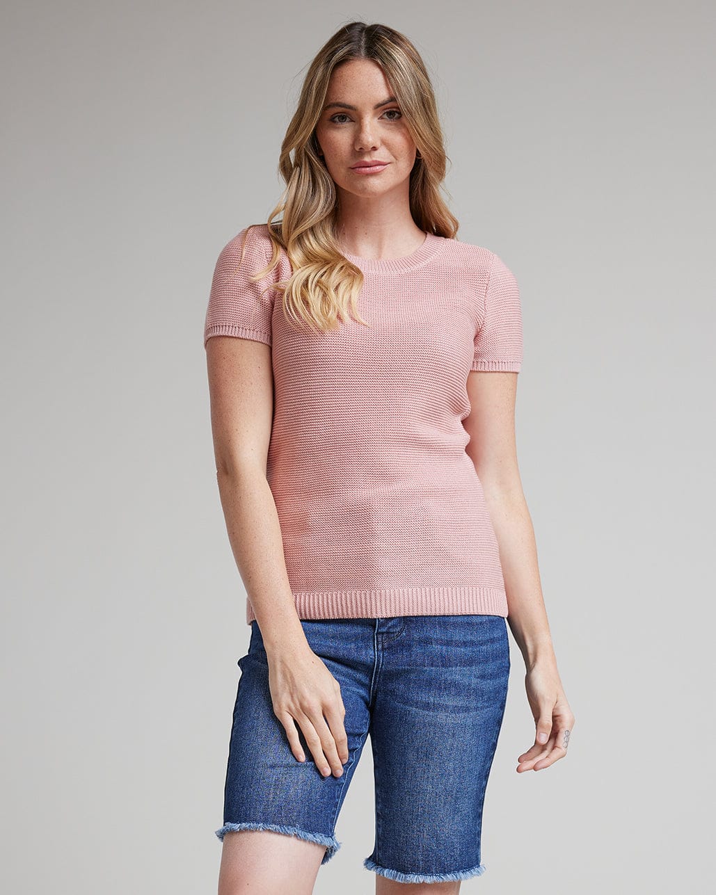 Woman in short sleeve textured sweater