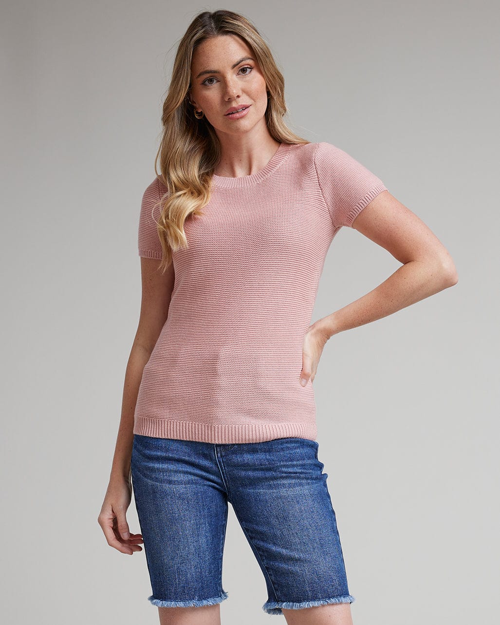 Woman in short sleeve textured sweater