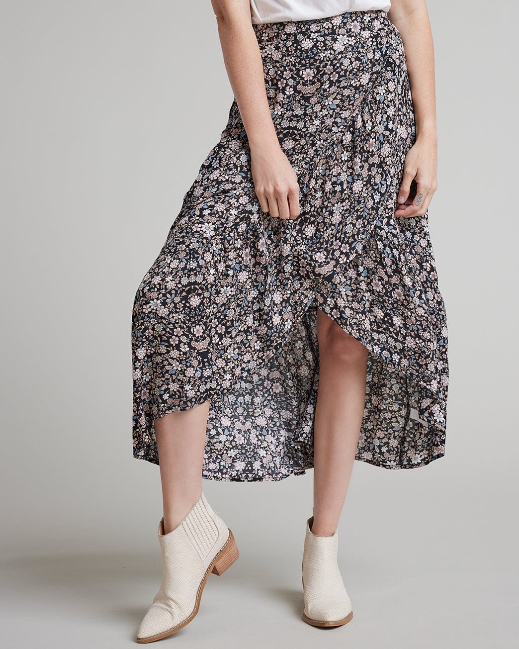 Woman in a floral printed wrap skirt