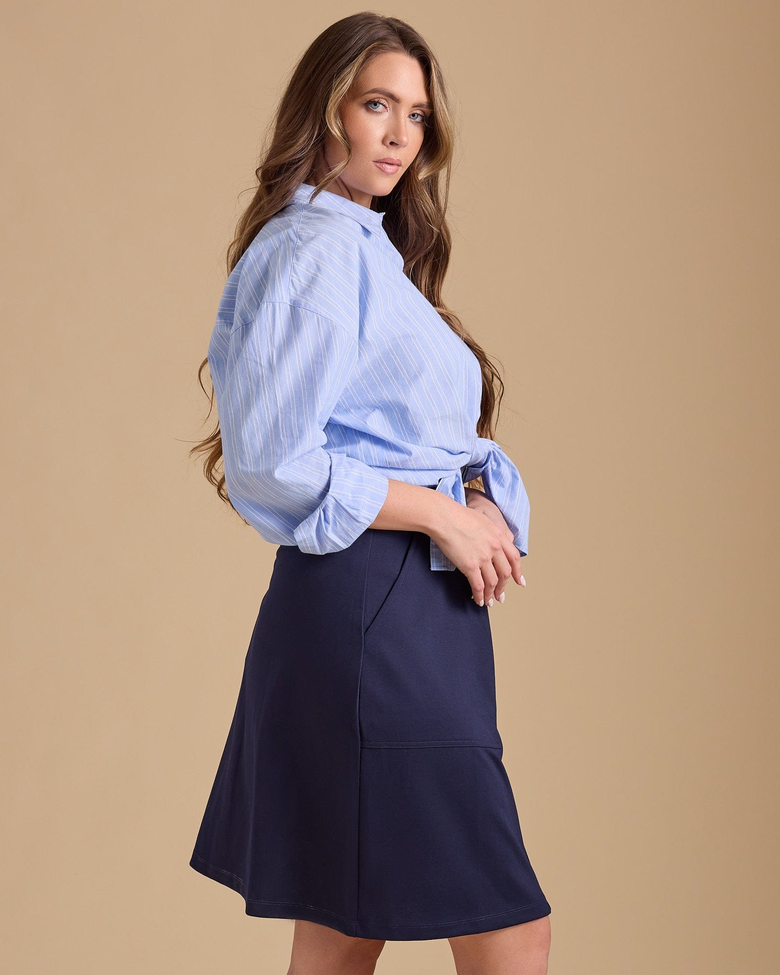 Woman in blue, buttondown skirt