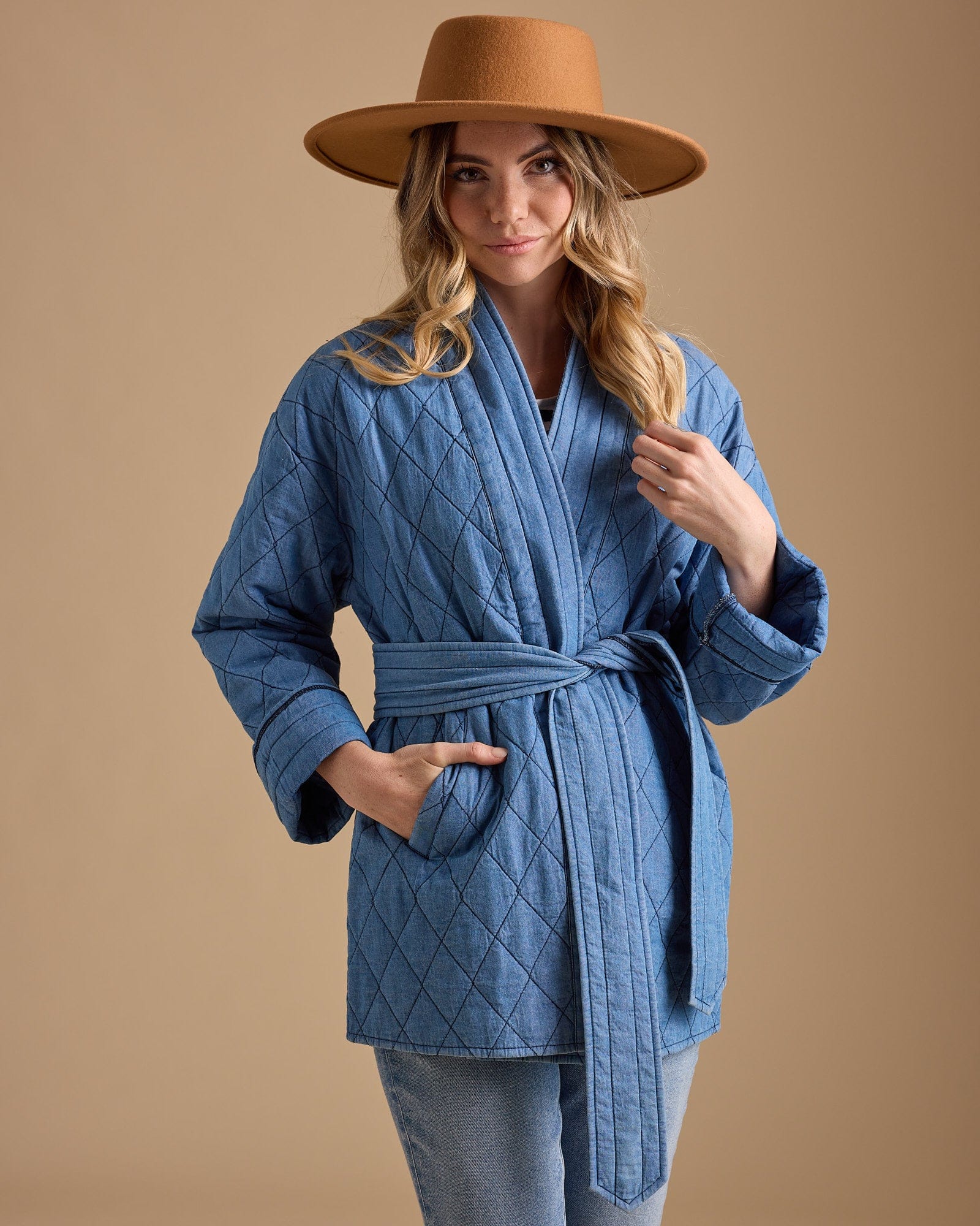 Woman in blue long sleeve quilted jacket