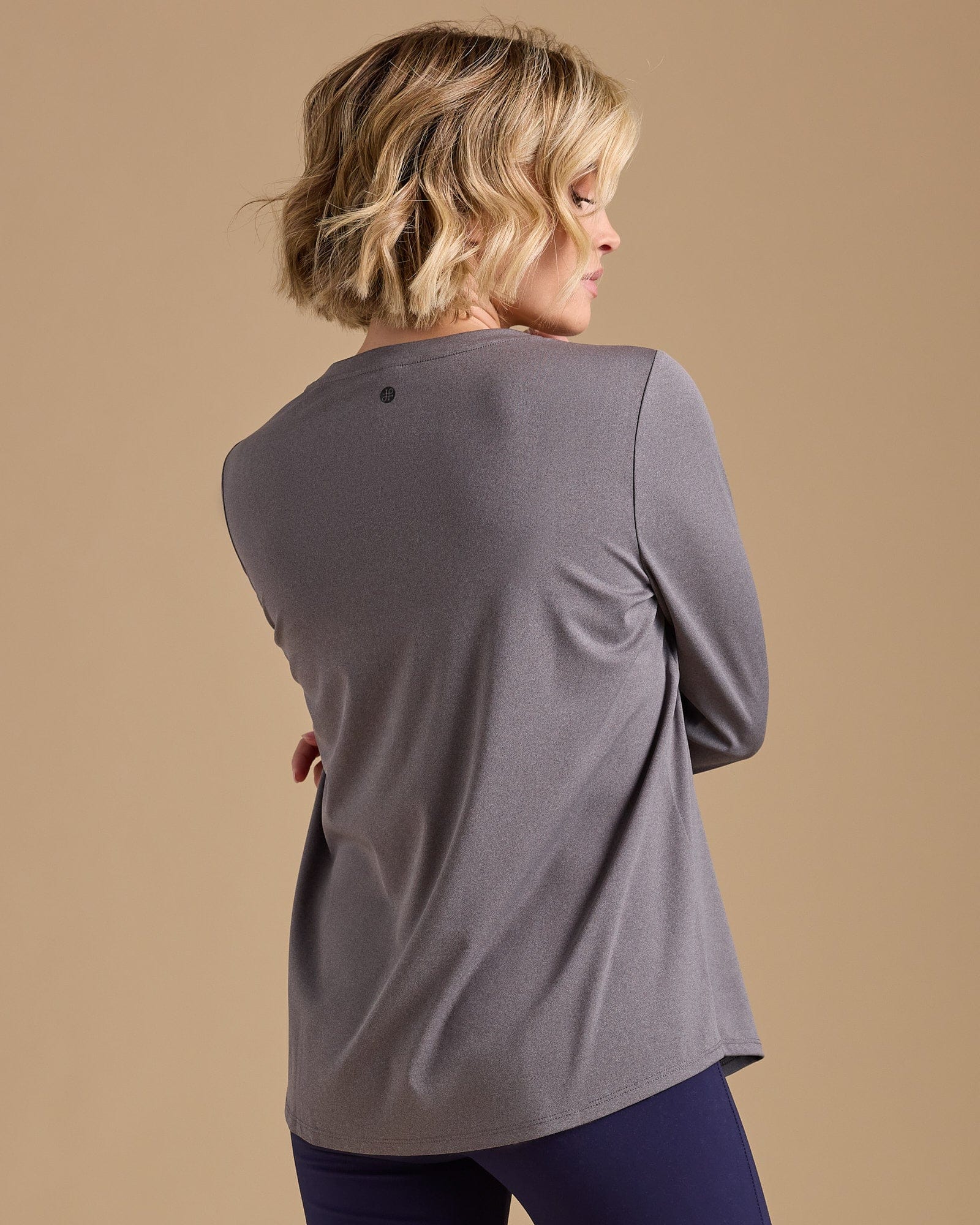 Woman in a grey long sleeve tshirt