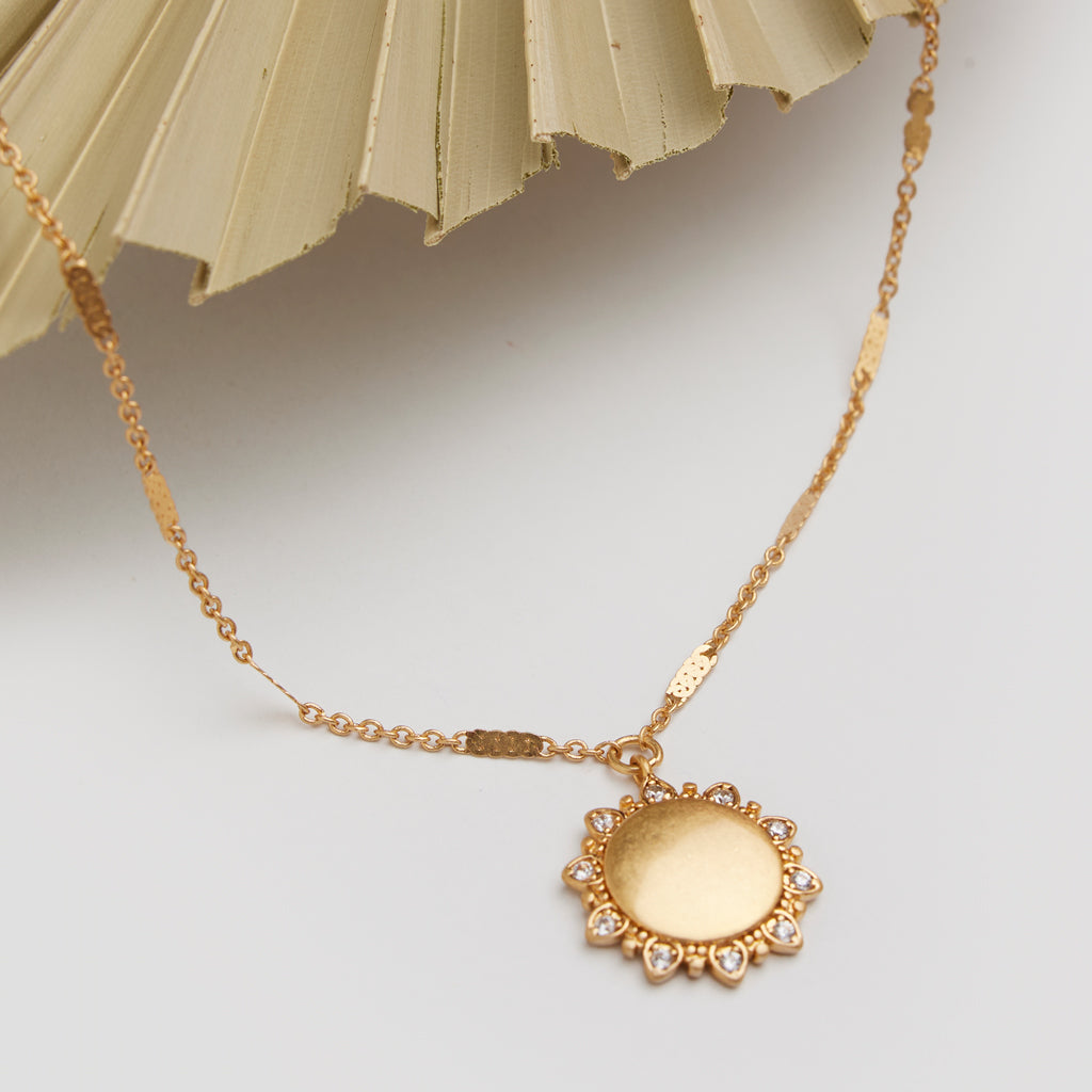 A necklace with a pendant shape like the sun. Shop Necklaces & Pendants. 