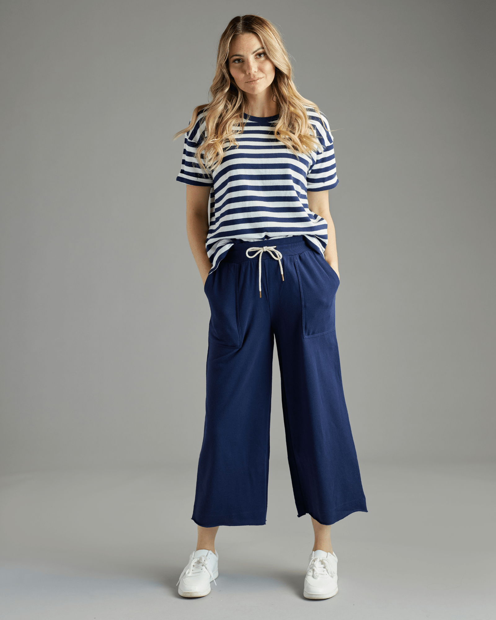 Woman in navy cropped pants
