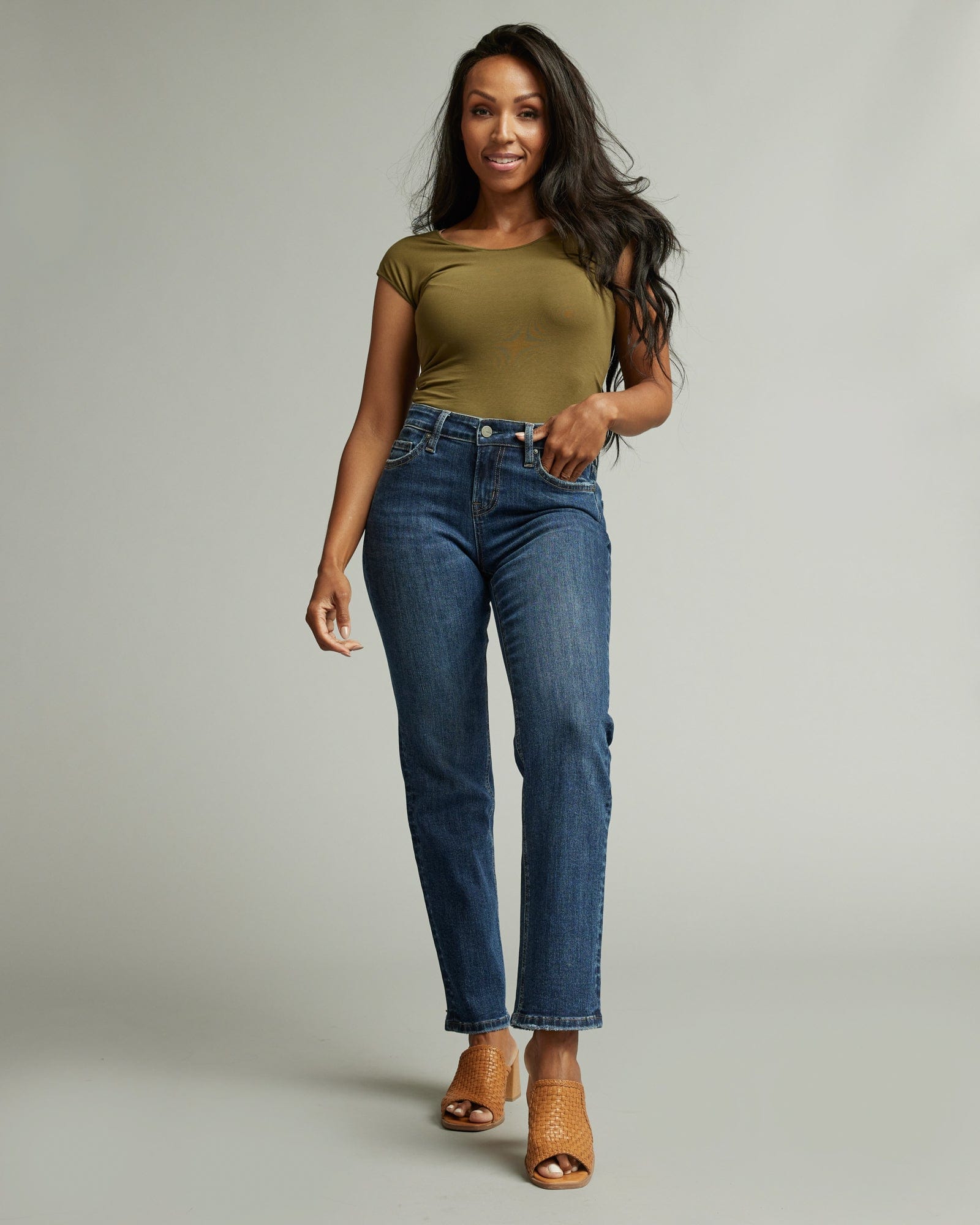 Woman in mid-rise straight jeans