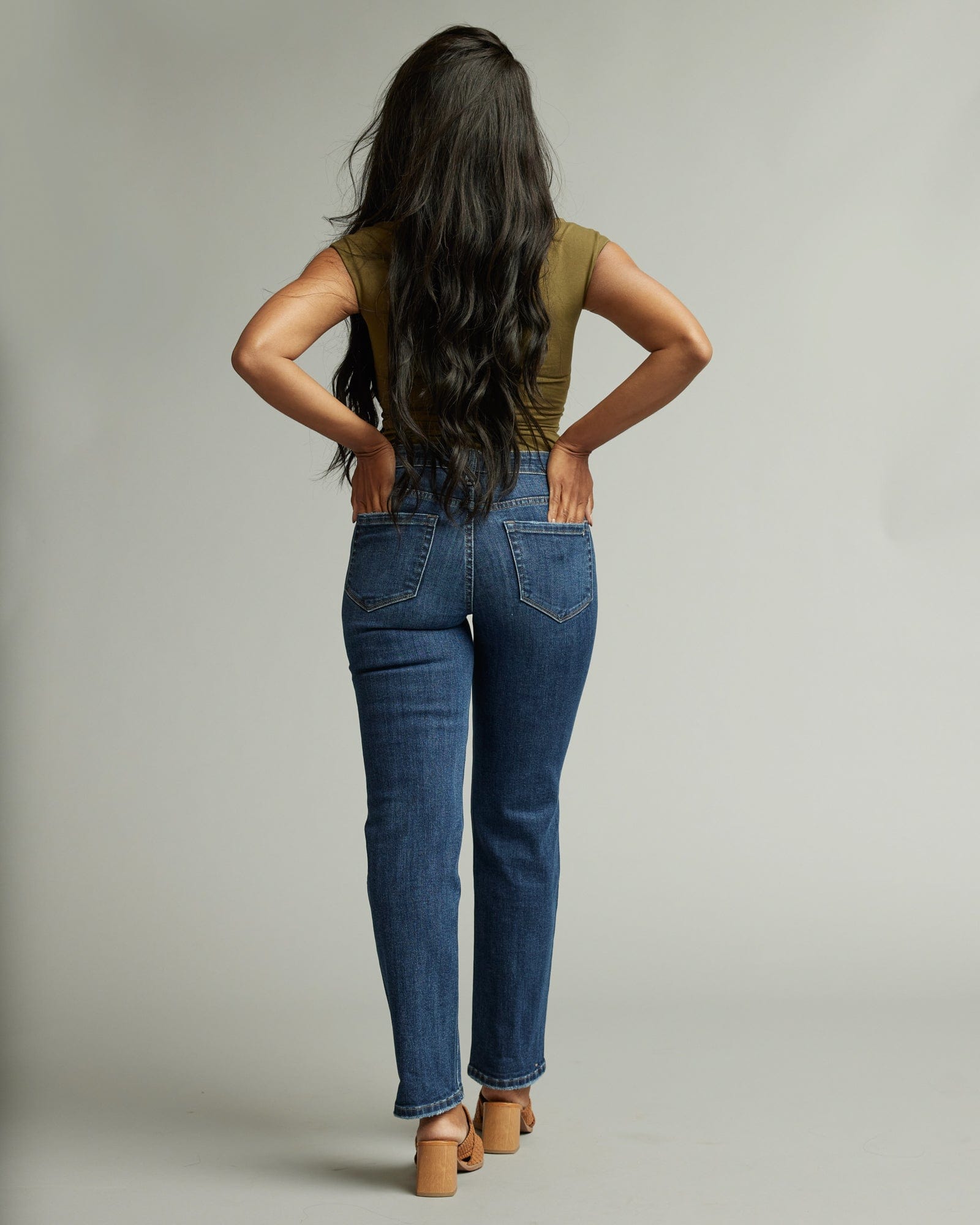 Woman in mid-rise straight jeans
