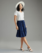 Woman in a blue knee-length skirt