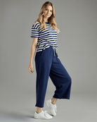Woman in navy cropped pants
