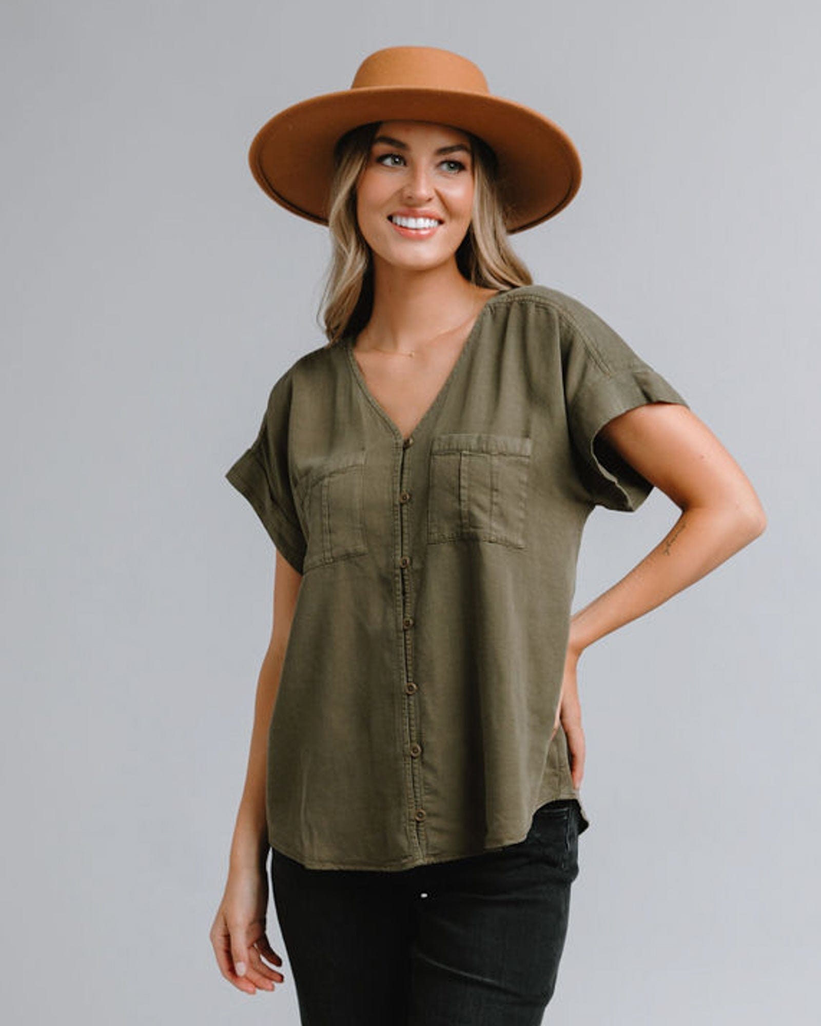 Woman in a short sleeve, v-neck blouse with front seam