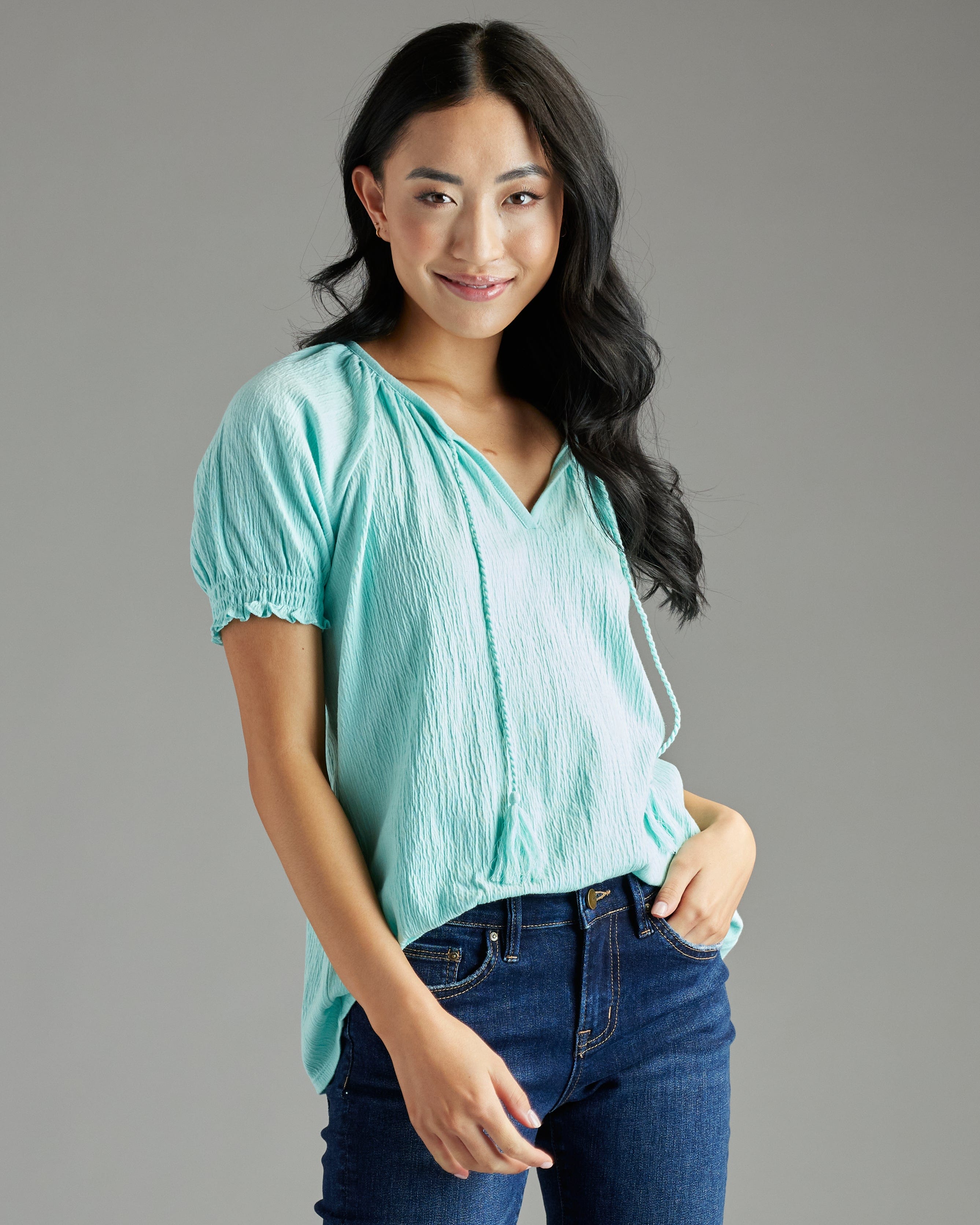 Woman in a blue short sleeved blouse