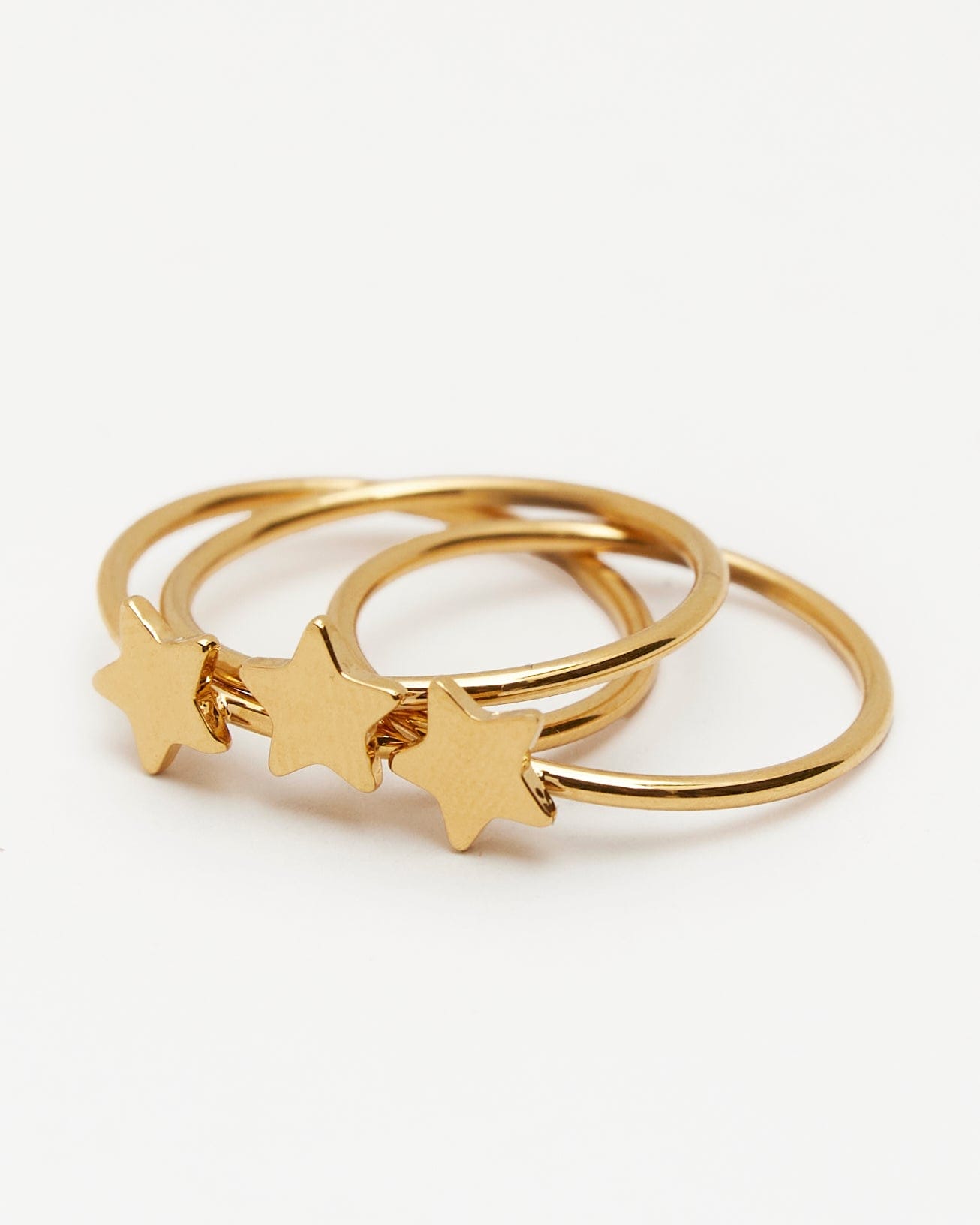 3 gold rings with star on center