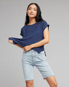 Woman in a blue short sleeve t-shirt