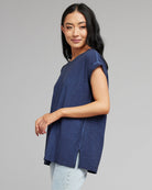 Woman in a blue short sleeve t-shirt