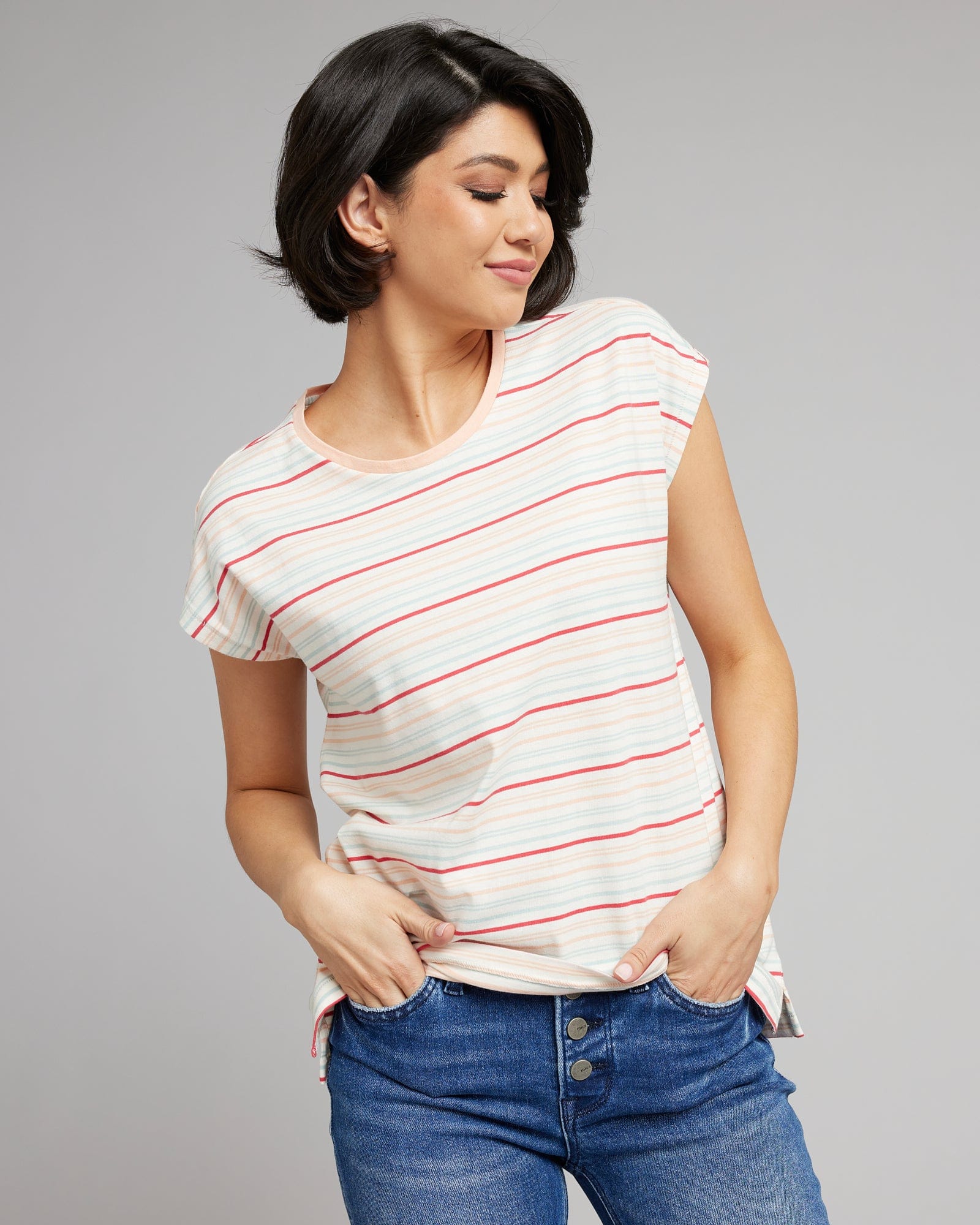 Woman in a multicolored strip t-shirt with short sleeves