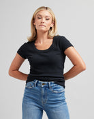 Woman in a short sleeve, black, fitted tee