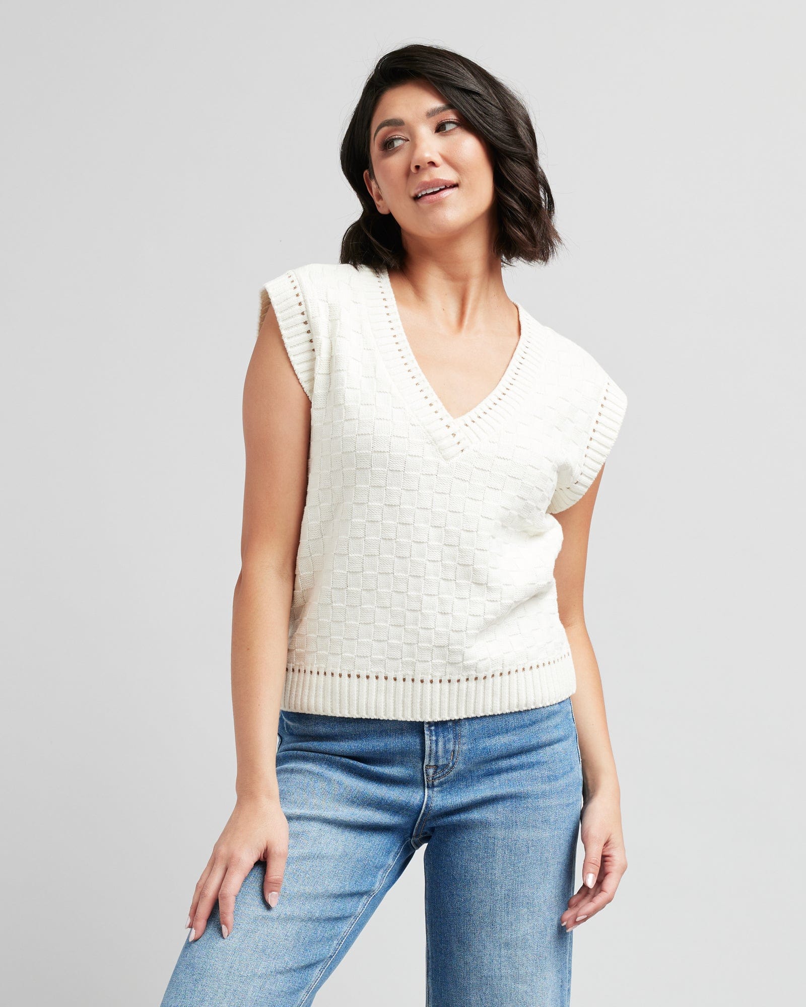 Woman in a textured knit pullover vest