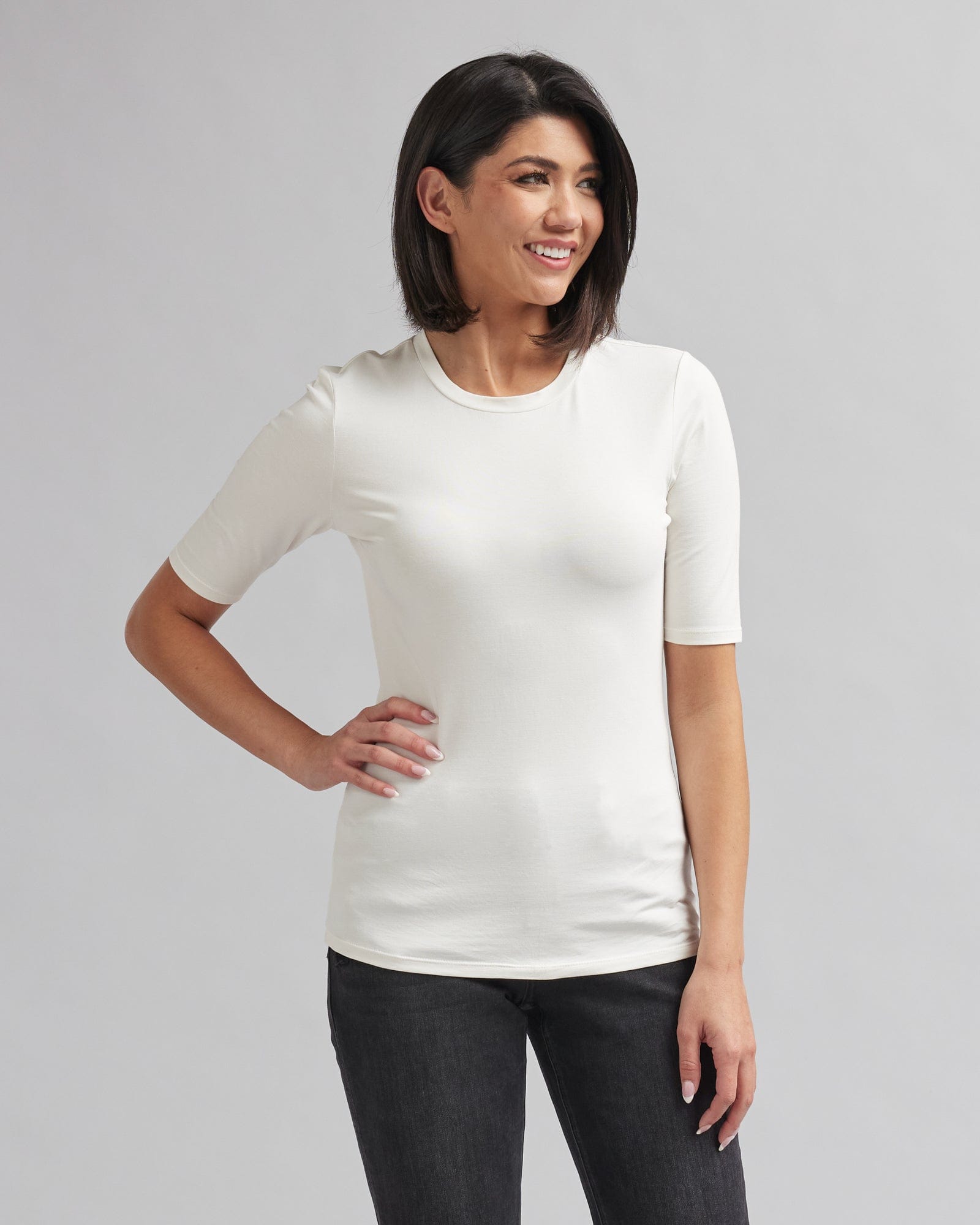 Woman in a half sleeved, basic t-shirt